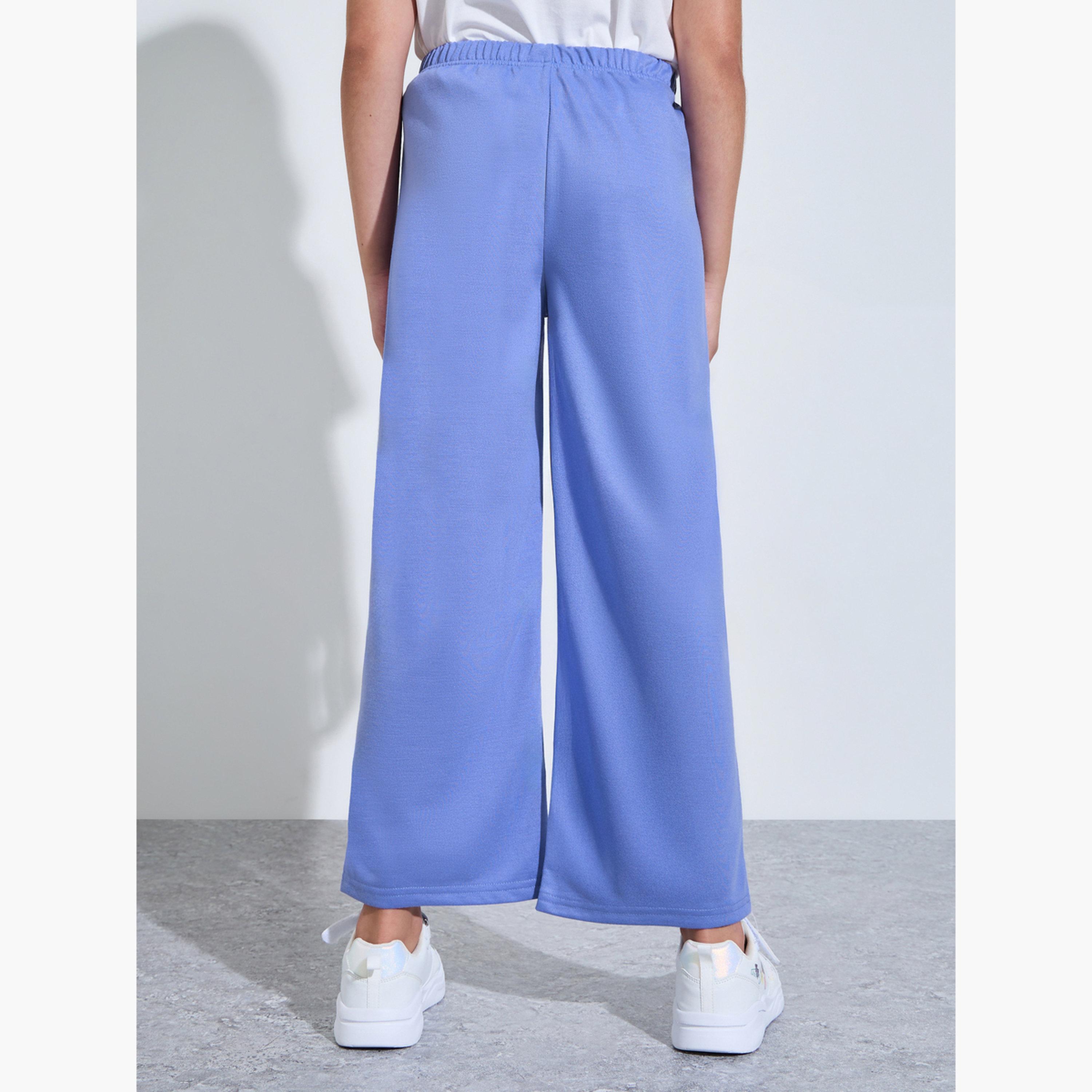 جوغر بأرجل واسعة وطبعة جرافيك للبنات لون أزرق-girls-clothing-bottoms-joggersandtrackpants-image-4
