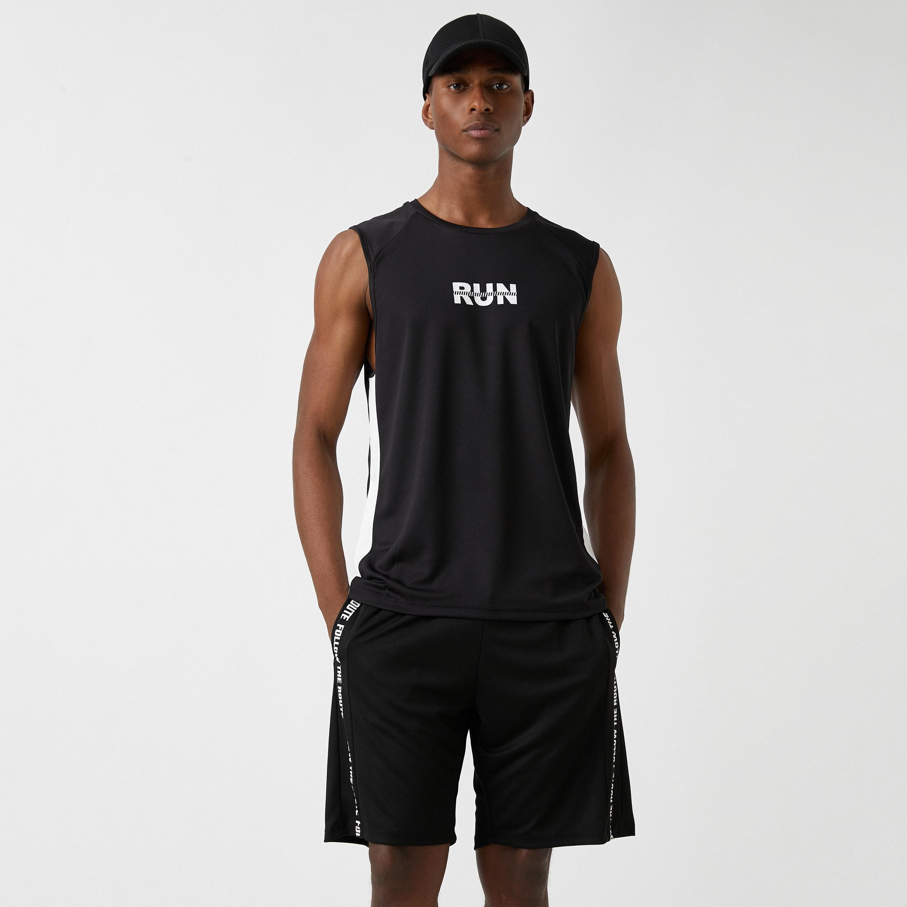 تي شيرت تانك رياضي رجالي بدون أكمام بياقة مستديرة وطبعة نصية من كوتون-men-clothing-sportswearandactivewear-tshirtsandpolos-image-1