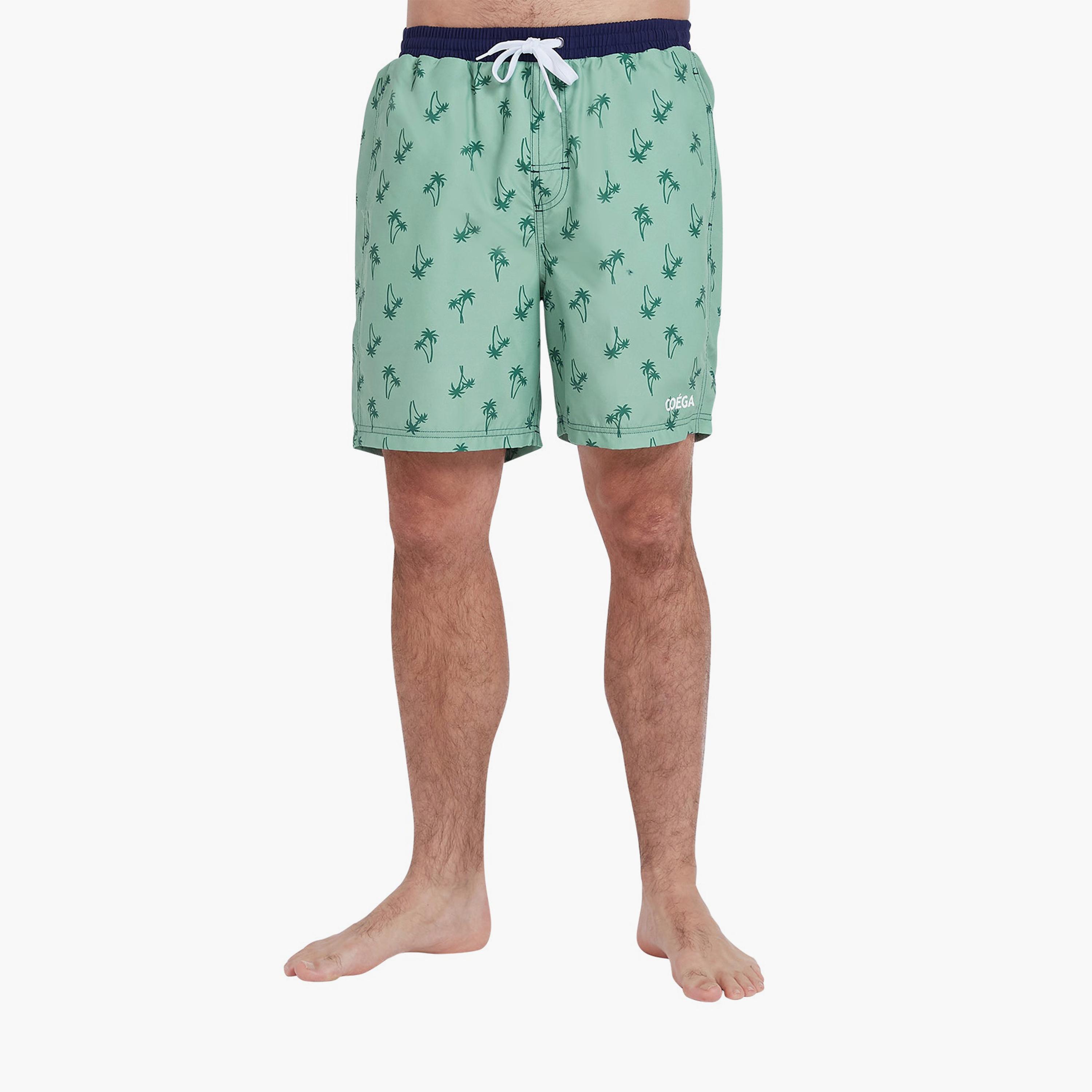 كويغا - شورت سباحة رجالي، أزرق داكن بنقشة نخيل الربيع-sports-men-clothing-swimwear-image-1