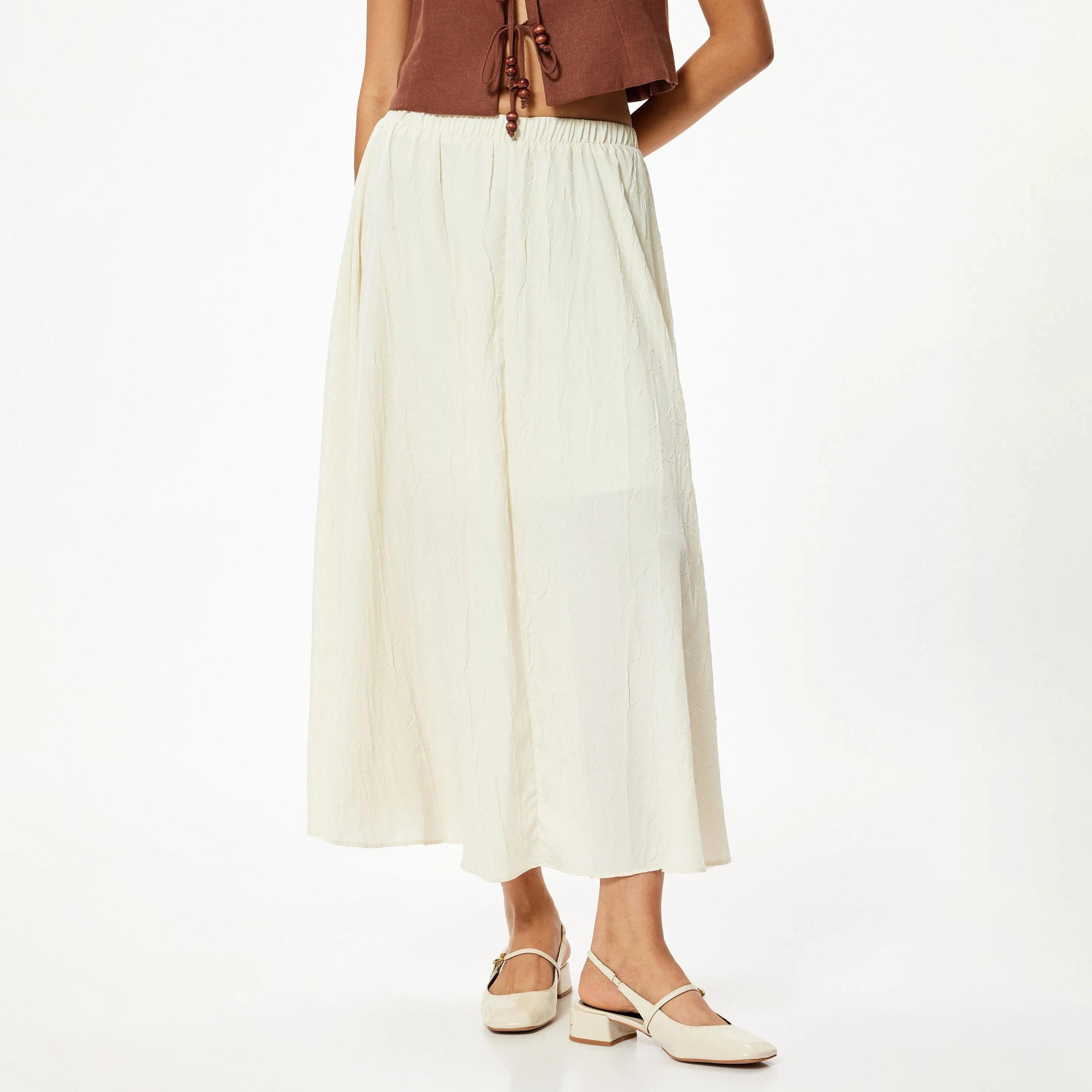 تنورة نسائية ذات خصر مطاطي مجعد باللون الكريمي من كوتون-women-clothing-bottoms-skirts-image-1