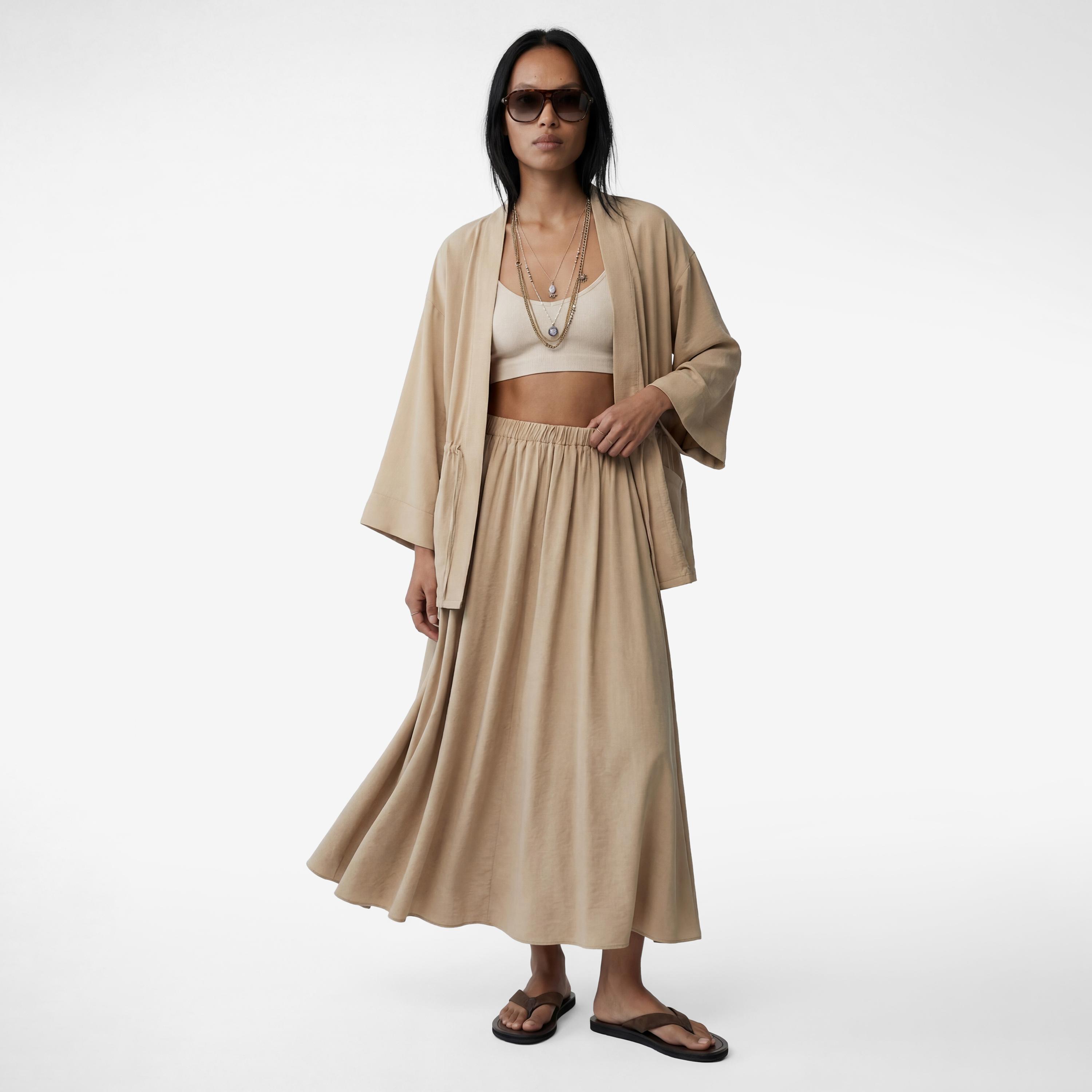 تنورة ميدي نسائية بقصة كلوش (فلير) بلون بيج من كوتون-women-clothing-bottoms-skirts-image-2