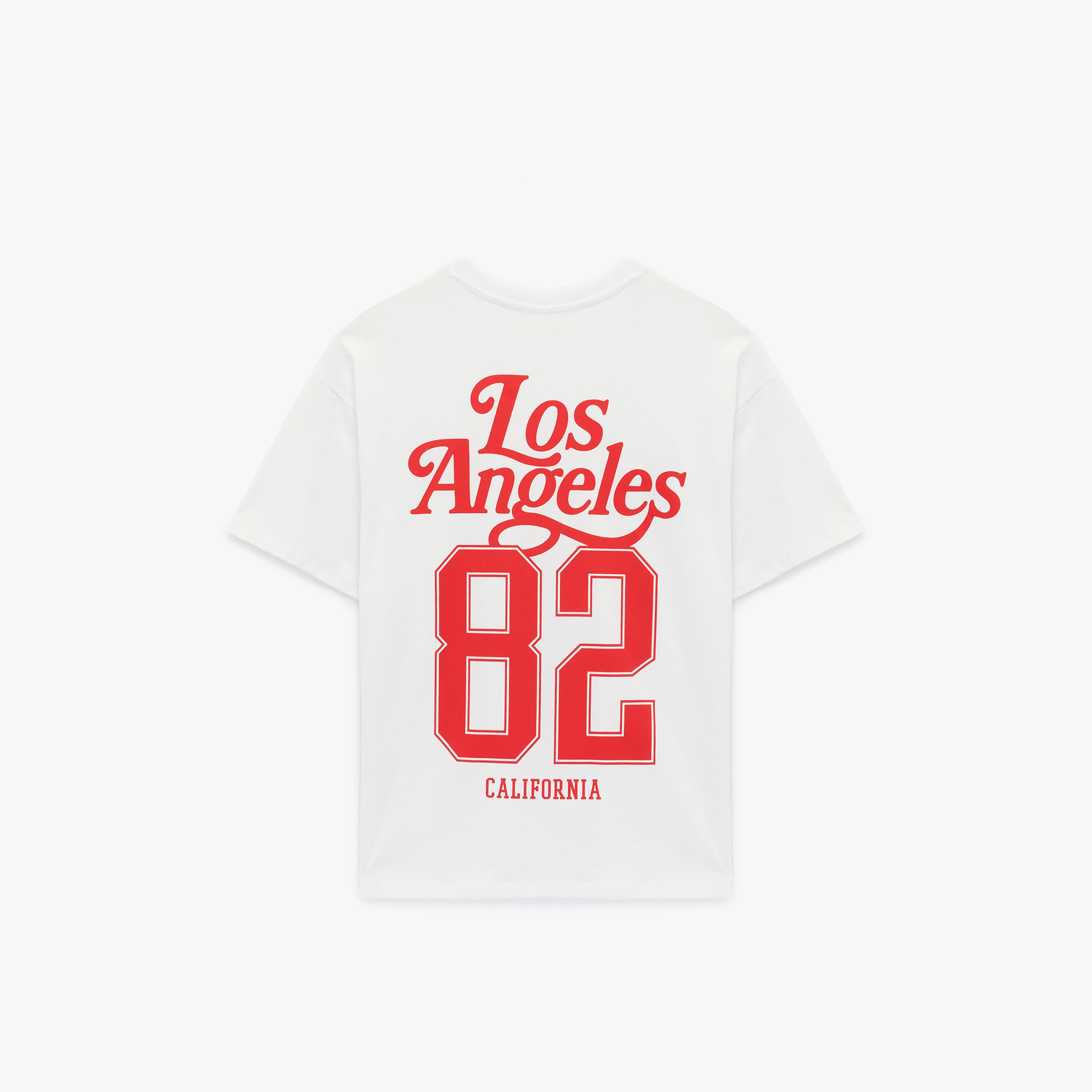 تيشيرت "فارسيتي" جامعي قطني بطبعة "غرافيك" بلون أبيض من كوتون-women-clothing-tshirts-image-4