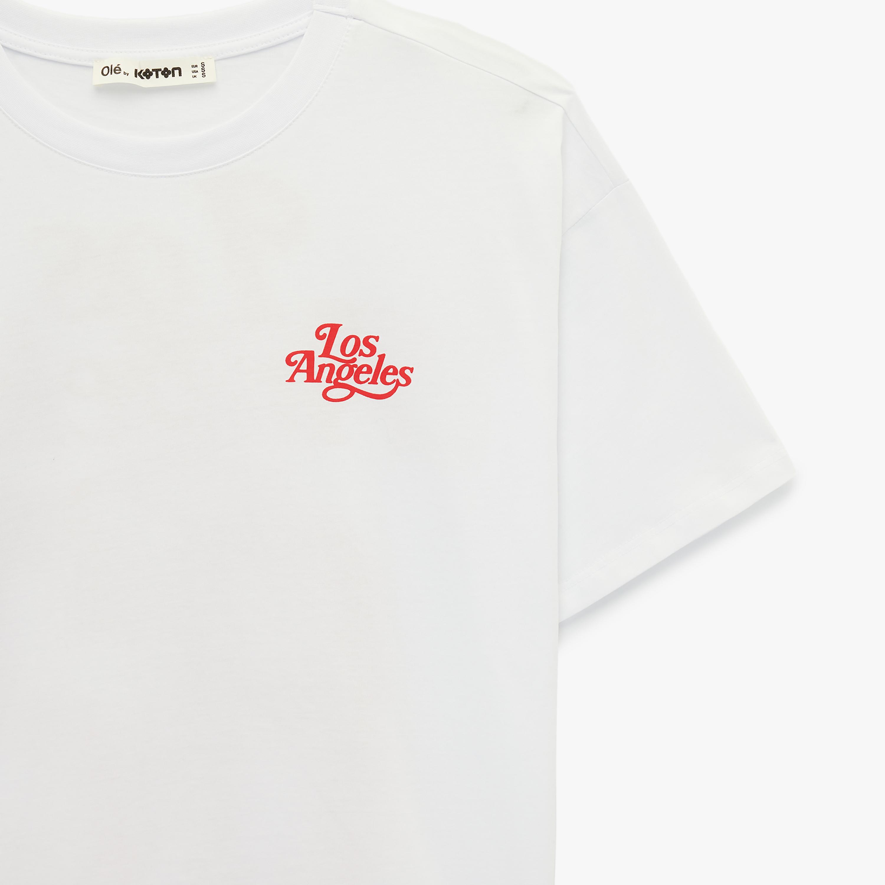 تيشيرت "فارسيتي" جامعي قطني بطبعة "غرافيك" بلون أبيض من كوتون-women-clothing-tshirts-image-5
