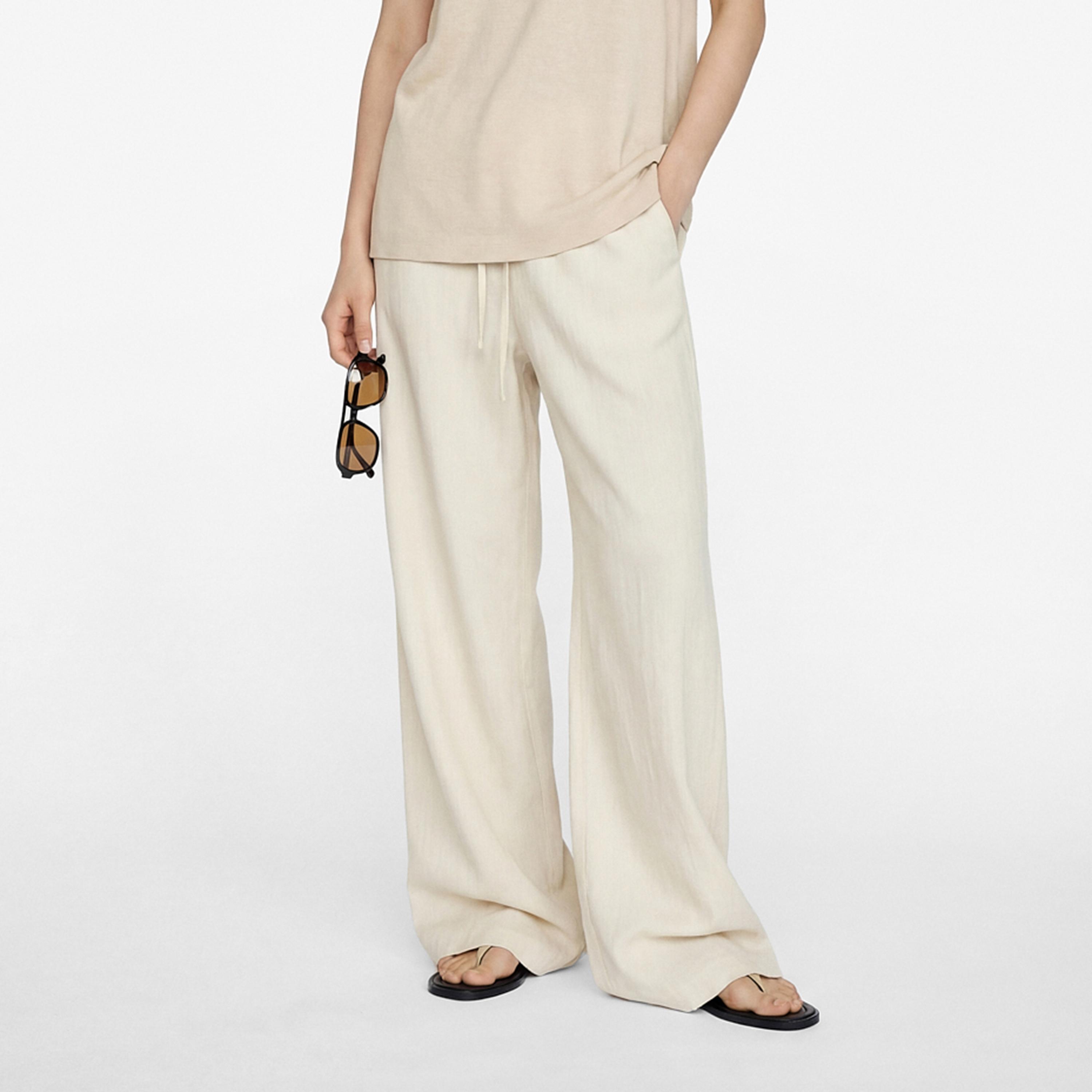 بنطلون نسائي واسع الساق بقماش كتان سادة بخصر برباط بلون كريمي من كوتون-women-clothing-bottoms-trousers-image-1