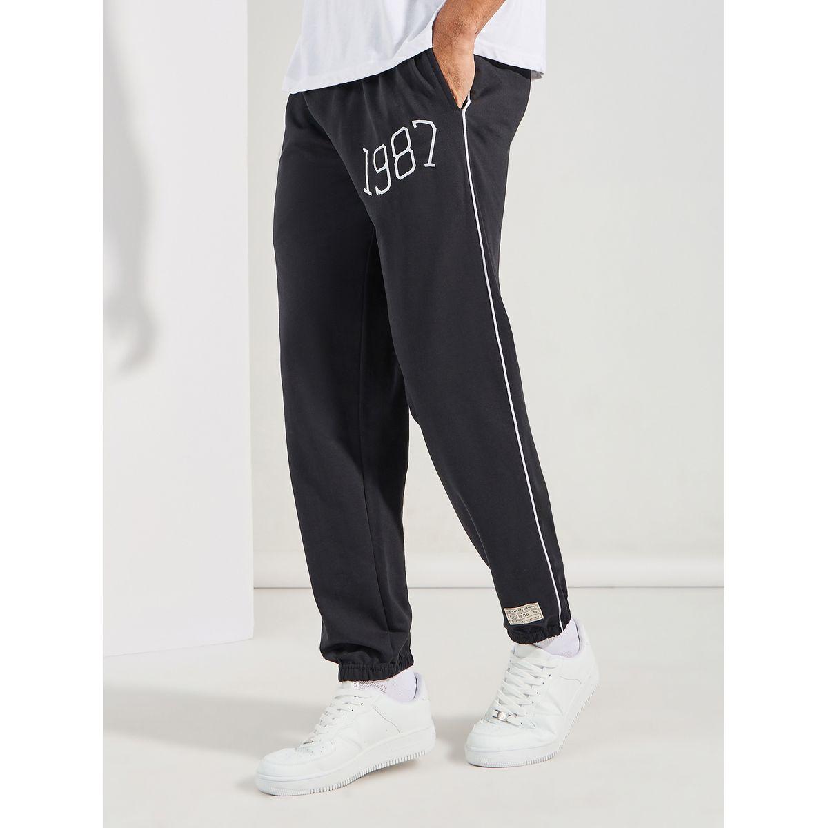 جوغر تيري بقصة مريحة وتفاصيل محزوزة-men-clothing-bottoms-joggers-image-3