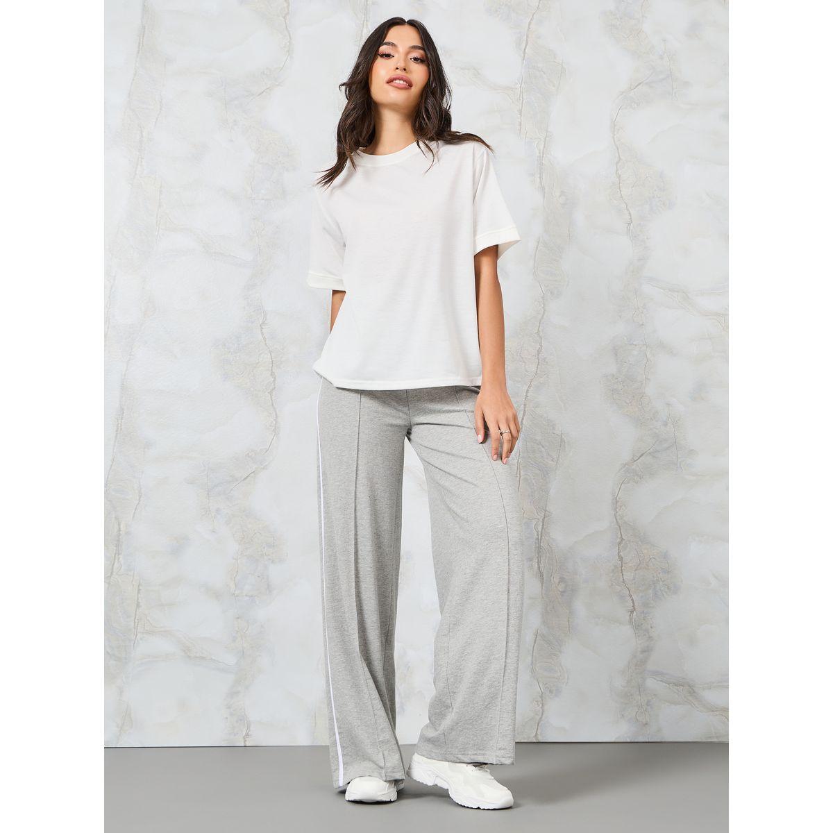 بنطال بأرجل واسعة وتداخلات محزوزة-women-clothing-bottoms-trousers-image-2