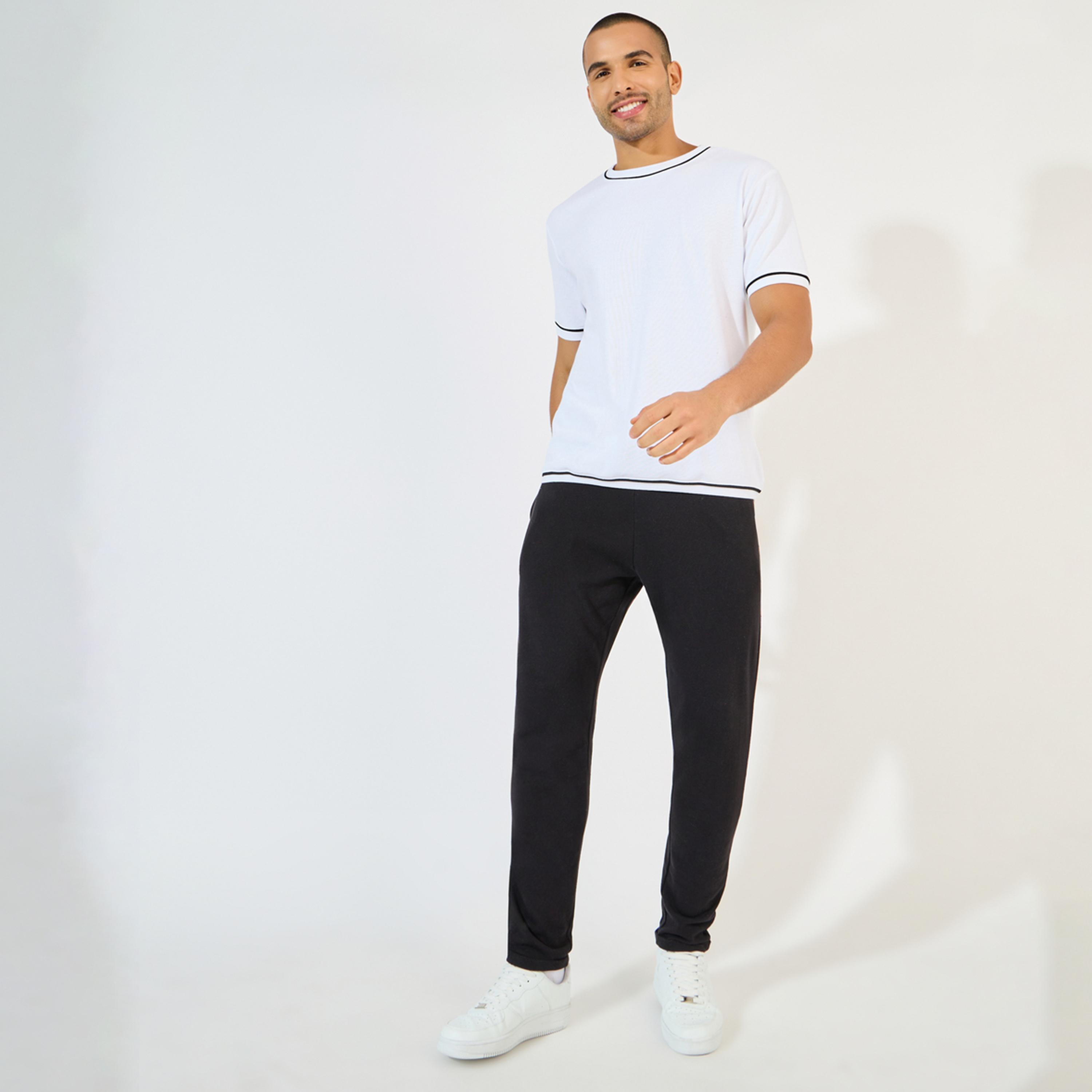 ستايلي - بنطال بيكيه محبوك بقصّة نحيفة مع حاشية مطوية-men-clothing-bottoms-trousersandchinos-trousers-image-2