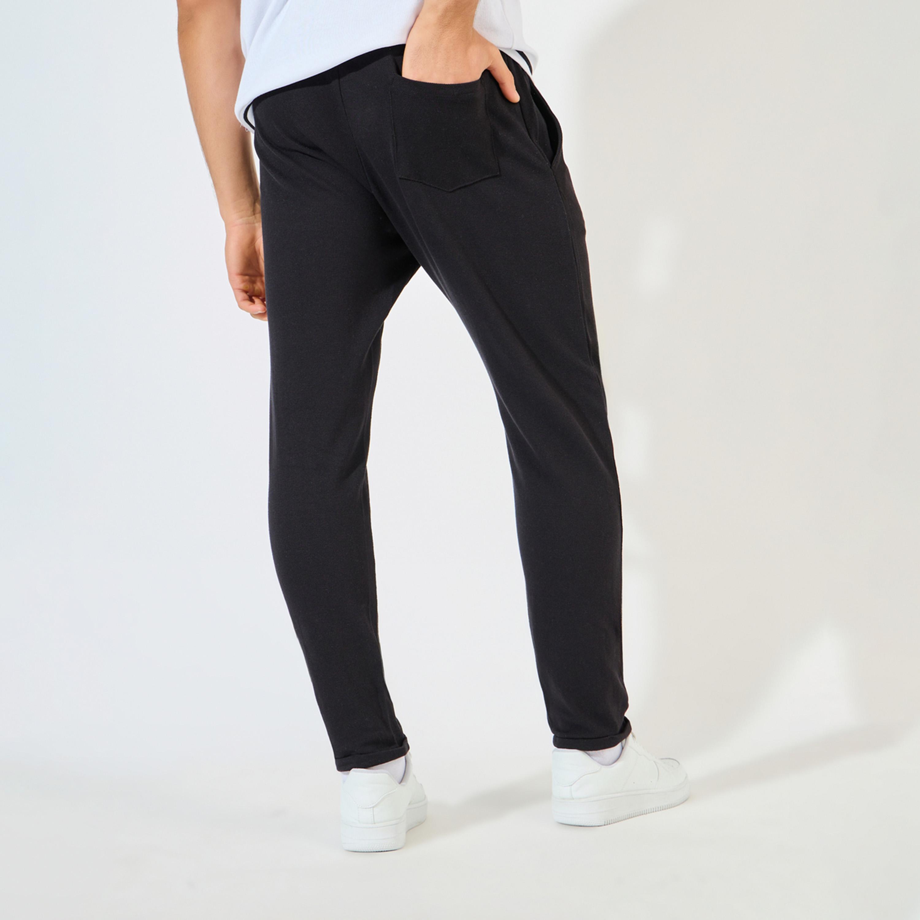 ستايلي - بنطال بيكيه محبوك بقصّة نحيفة مع حاشية مطوية-men-clothing-bottoms-trousersandchinos-trousers-image-4