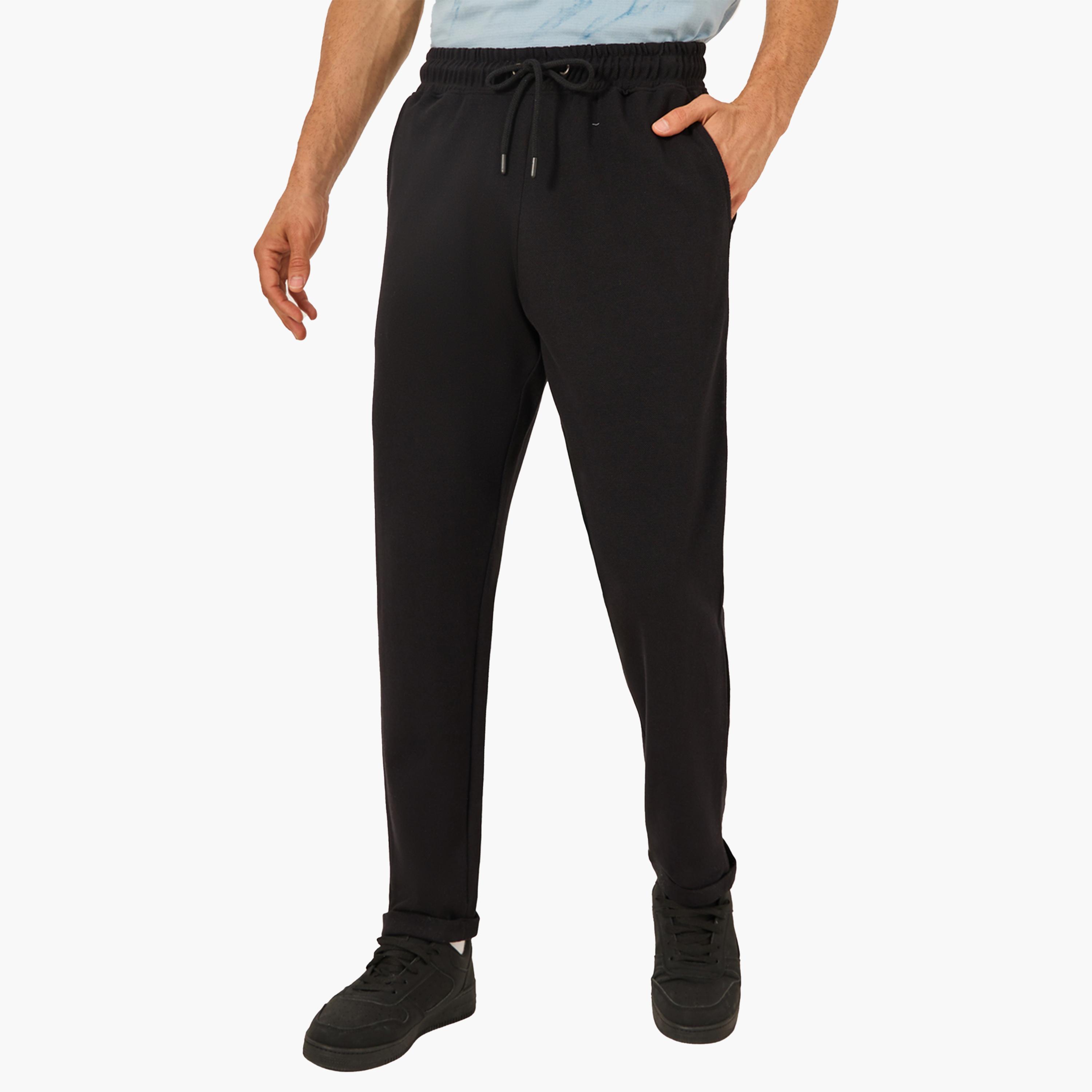 ستايلي - بنطال بيكيه محبوك بقصّة ضيقة مع حاشية مطوية-men-clothing-bottoms-trousersandchinos-trousers-image-1