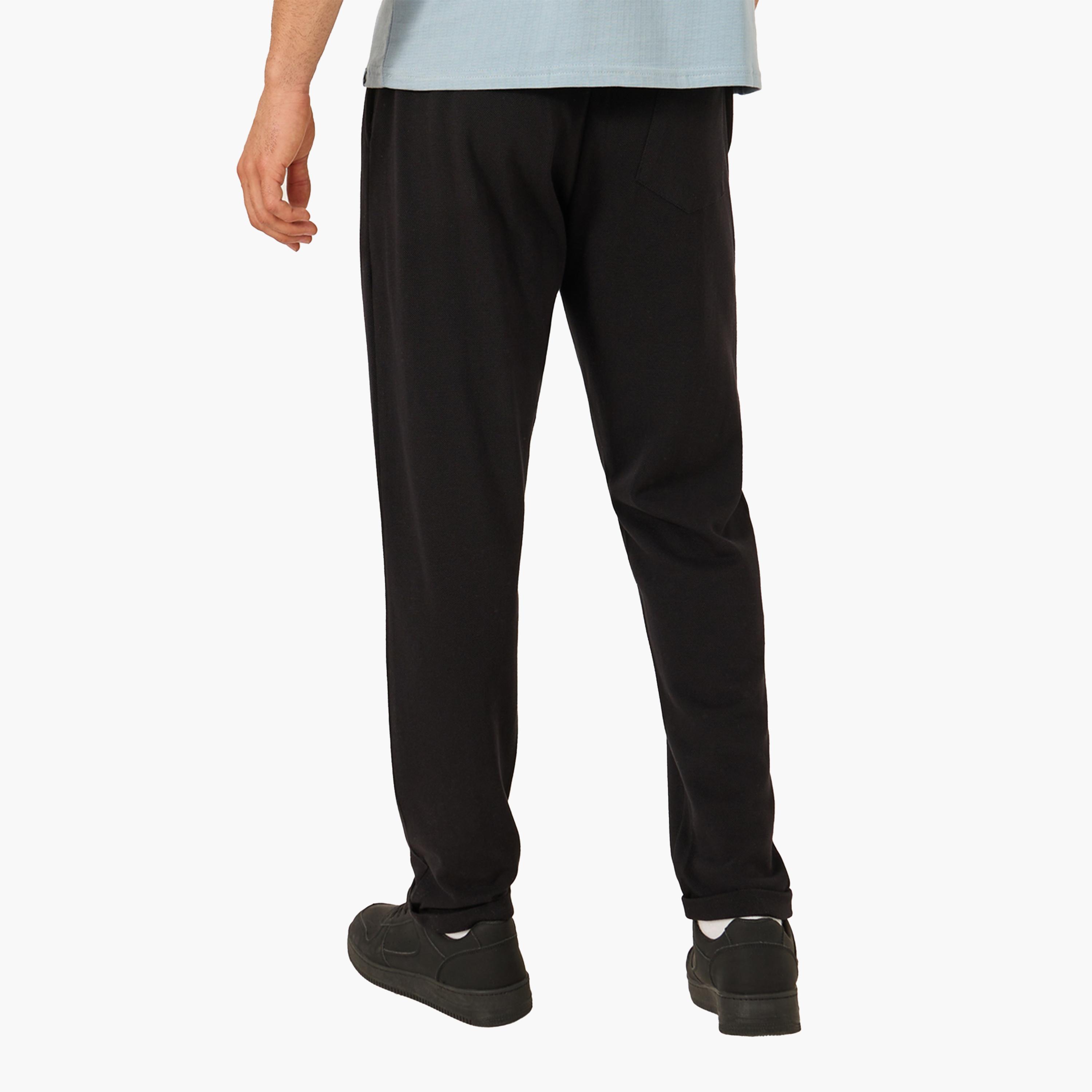 ستايلي - بنطال بيكيه محبوك بقصّة ضيقة مع حاشية مطوية-men-clothing-bottoms-trousersandchinos-trousers-image-4