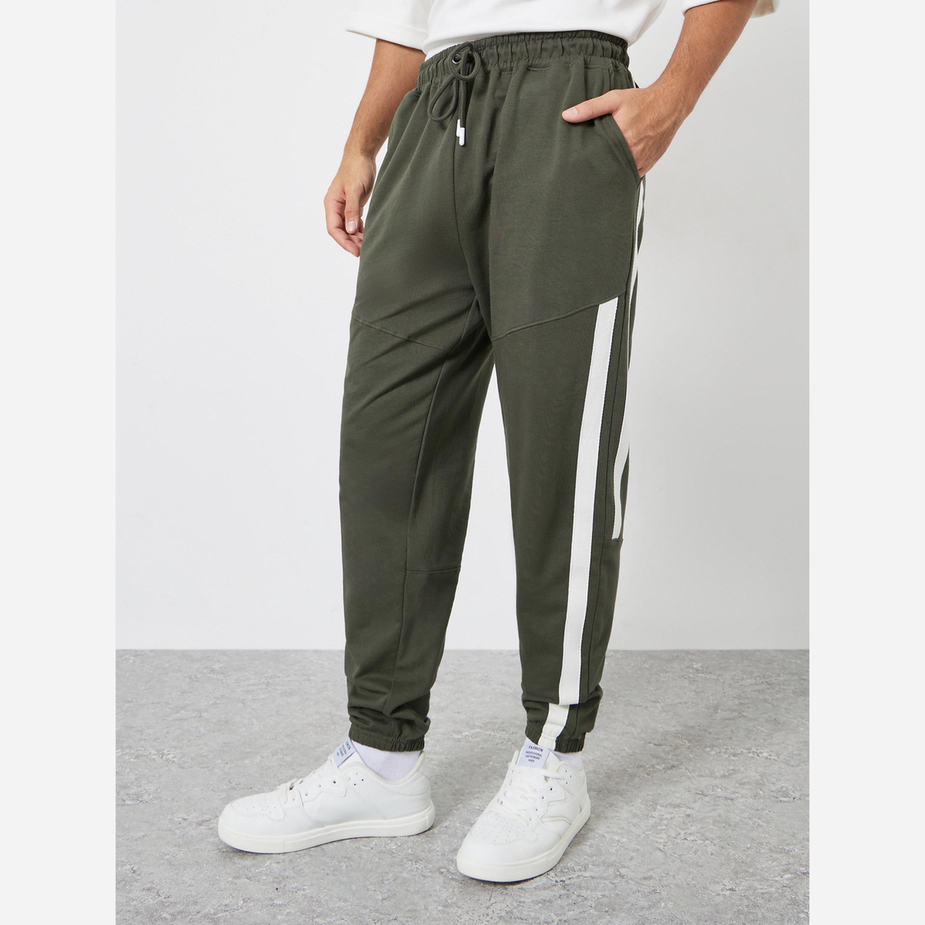 ستايلي - بنطال رياضي مقاس واسع بشريط قطن لون زيتوني-men-clothing-bottoms-joggers-image-1