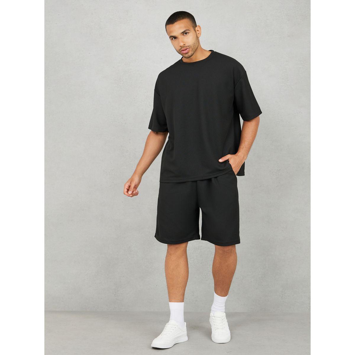 مجموعة من شورت وتيشيرت سادة واسع-men-clothing-coordsets-image-1