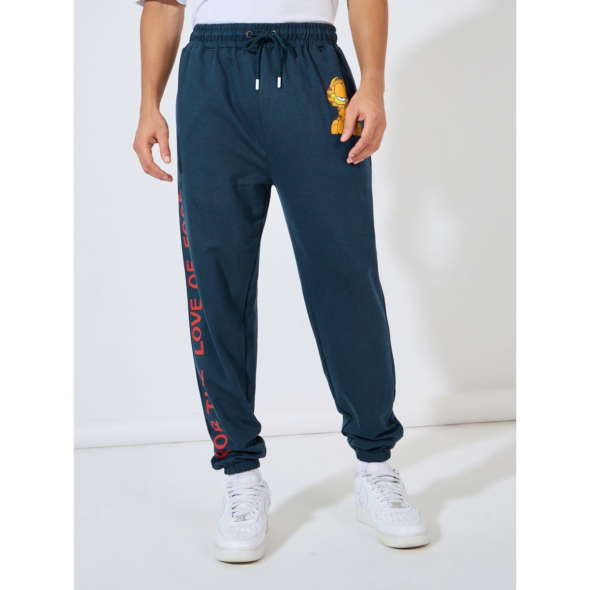 جوغر تيري بقصة فضفاضة وطبعة جرافيك-men-clothing-bottoms-joggers-image-1