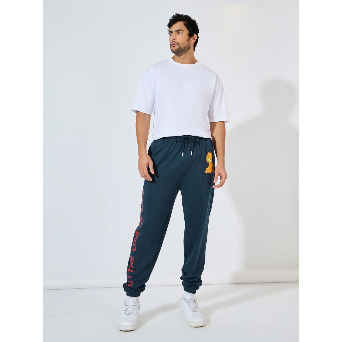 جوغر تيري بقصة فضفاضة وطبعة جرافيك-men-clothing-bottoms-joggers-image-2