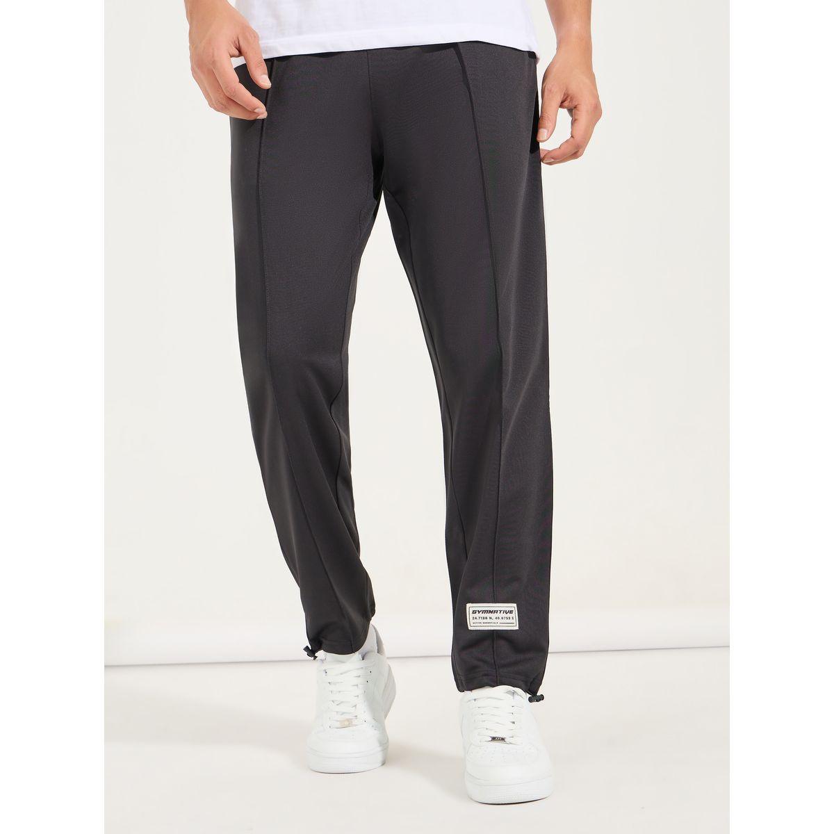 جوغر بتفاصيل محزوزة مع شارة-men-clothing-sportswearandactivewear-bottoms-joggers-image-1