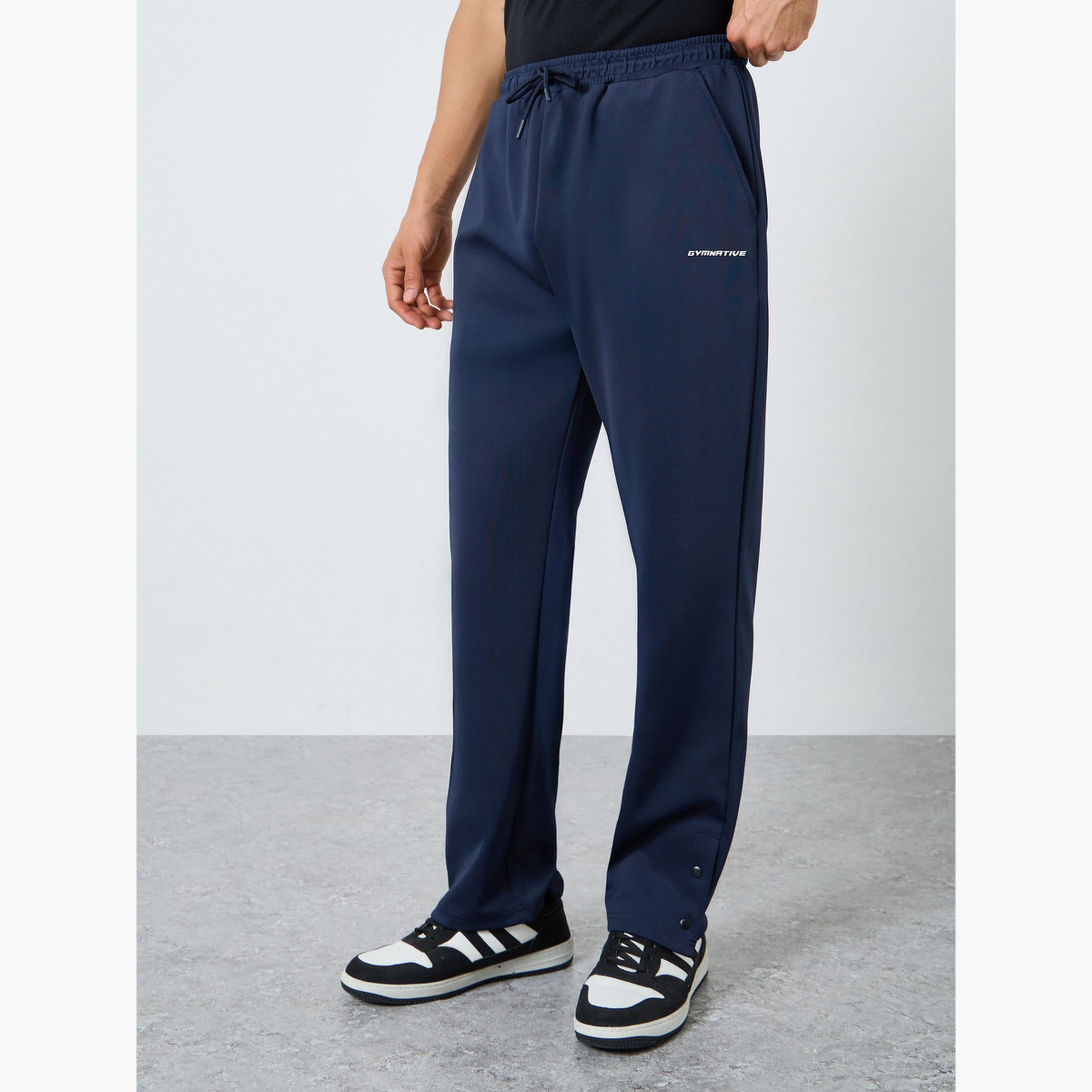 بنطال سكوبا بحواف مفتوحة وقصة مريحة للرجال-men-clothing-sportswearandactivewear-bottoms-joggers-image-1