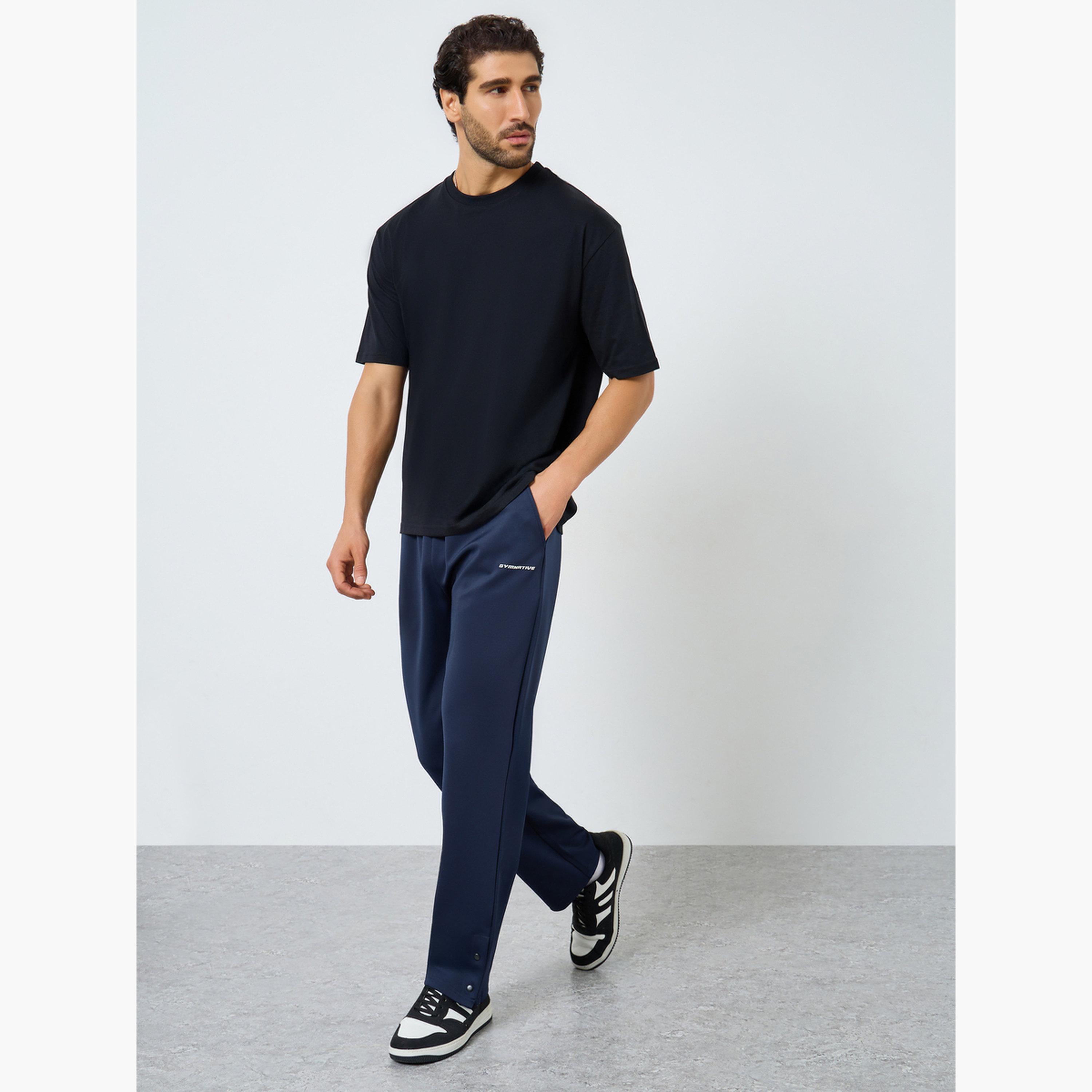 بنطال سكوبا بحواف مفتوحة وقصة مريحة للرجال-men-clothing-sportswearandactivewear-bottoms-joggers-image-2