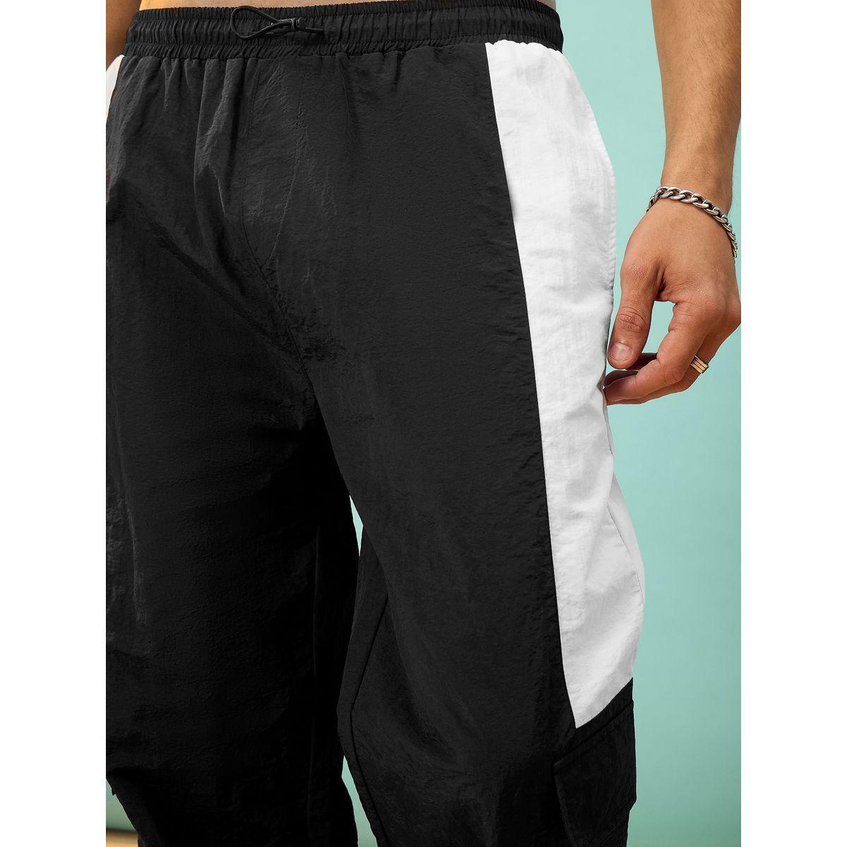 بنطال باراشوت مع جيب بطية وتفاصيل مُتباينة ماسكلن ساسافراس × ستايلي-men-clothing-bottoms-trousersandchinos-trousers-image-4