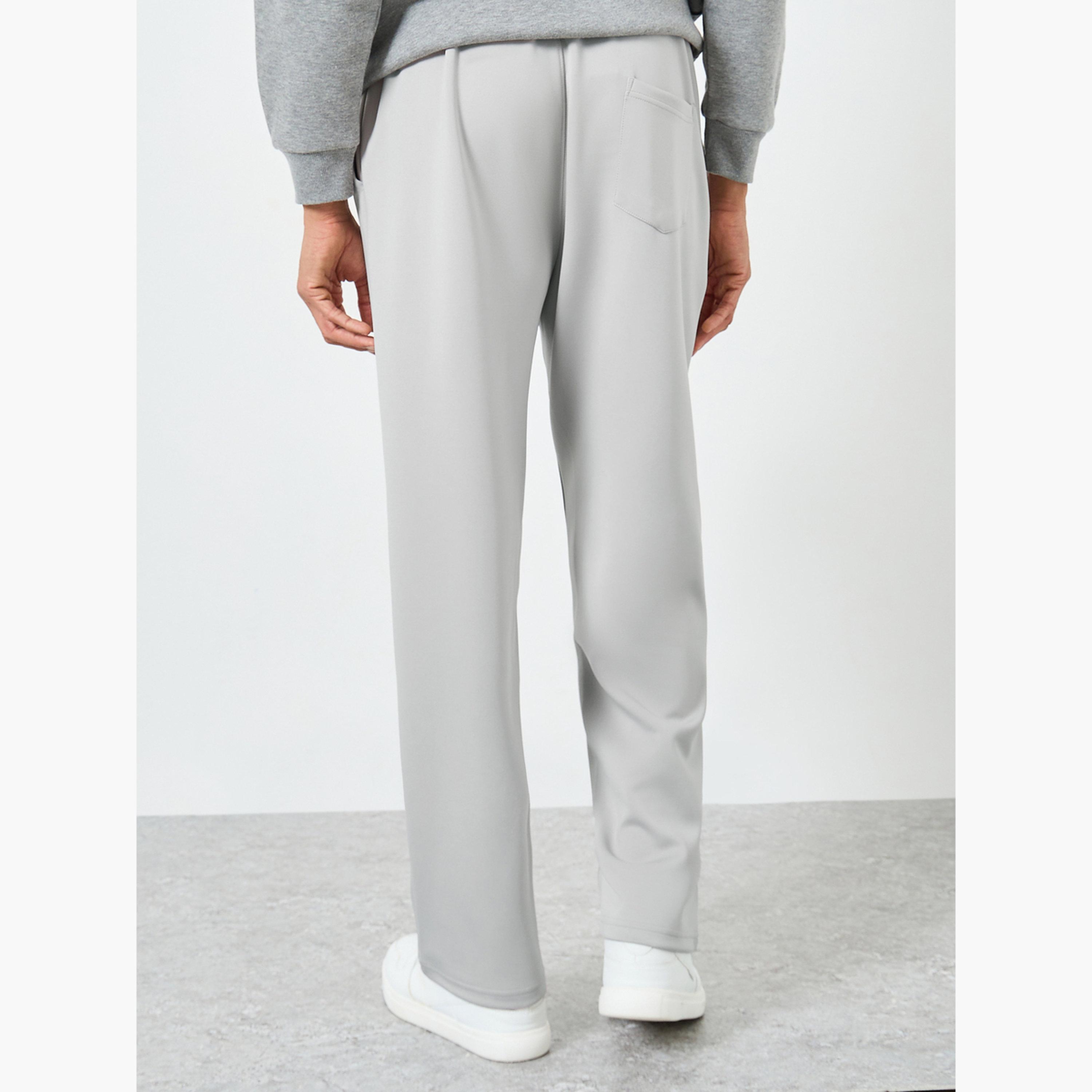 جوغر بقصة مريحة وحواف مفتوحة مع تفاصيل محزوزة-men-clothing-bottoms-joggers-image-3