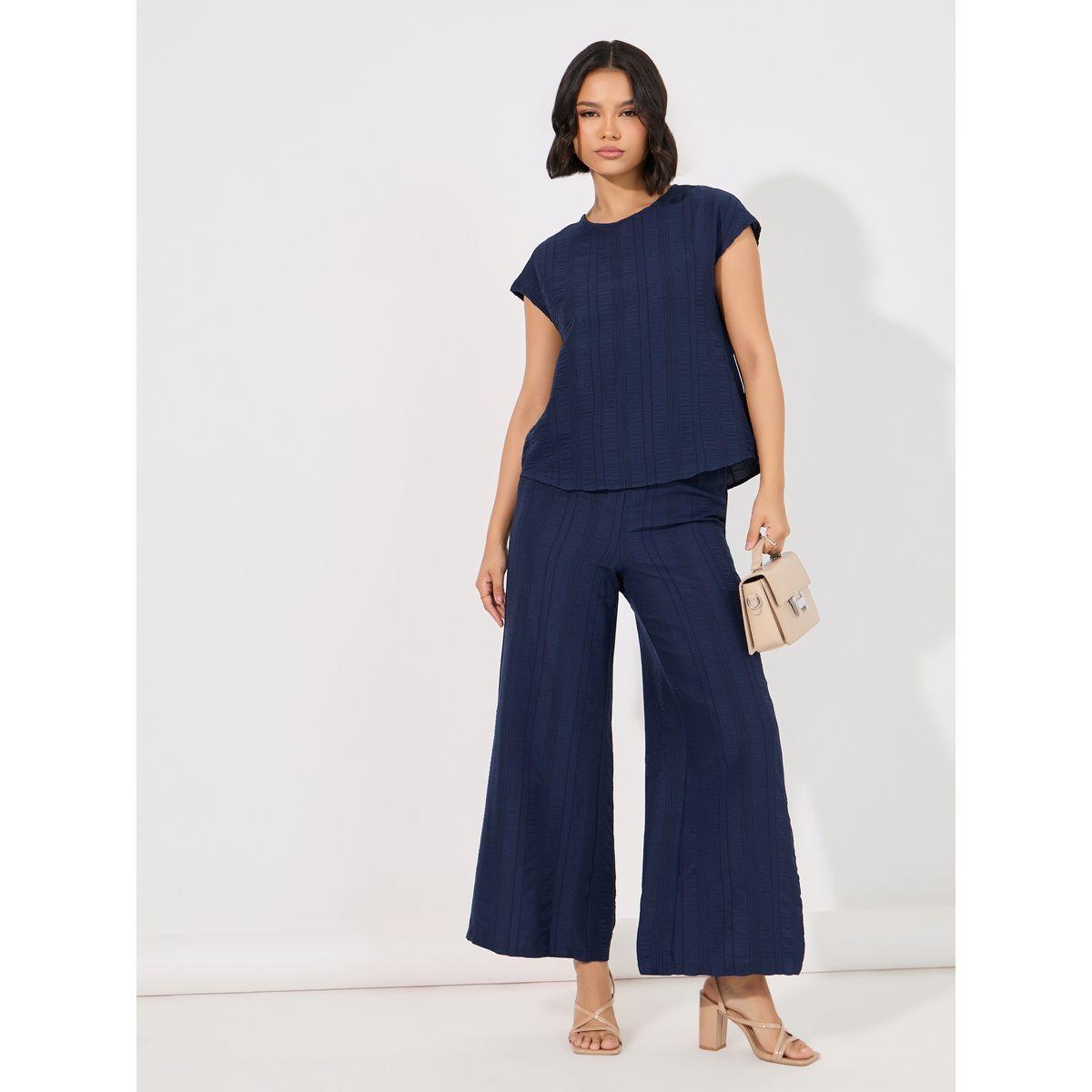 مجموعة من بنطال بأرجل واسعة مع بلوزة بتفاصيل بارزة الملمس-women-clothing-coordsets-image-1