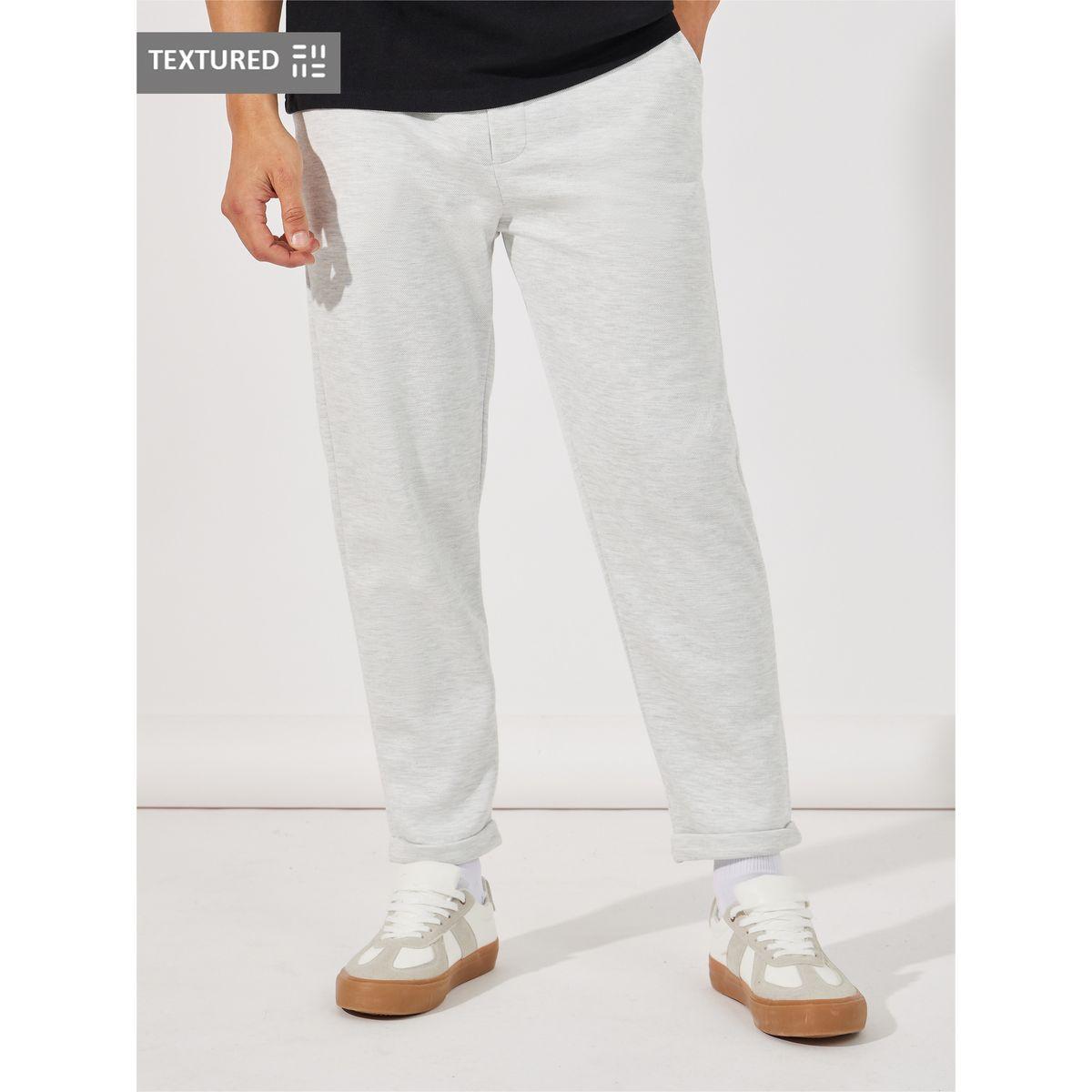 بنطال محبوك بقصة سليم فت وحافة مطوية-men-clothing-bottoms-trousersandchinos-trousers-image-1