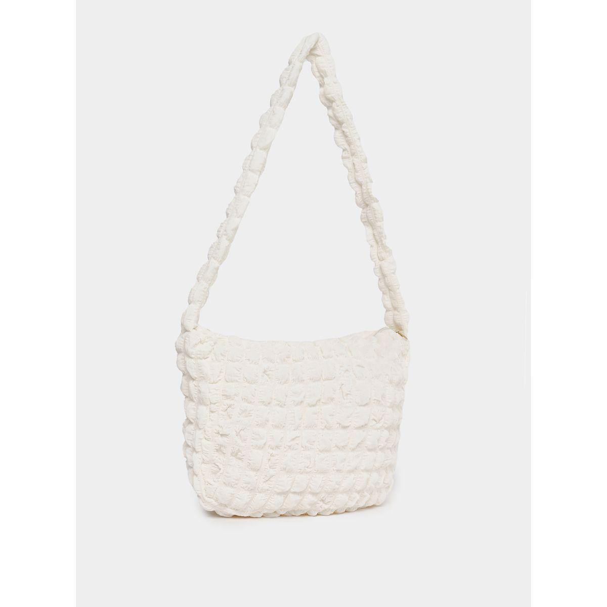شنطة بتفاصيل بارزة الملمس وسحَّاب غلق-women-bagsandwallets-handbags-image-1