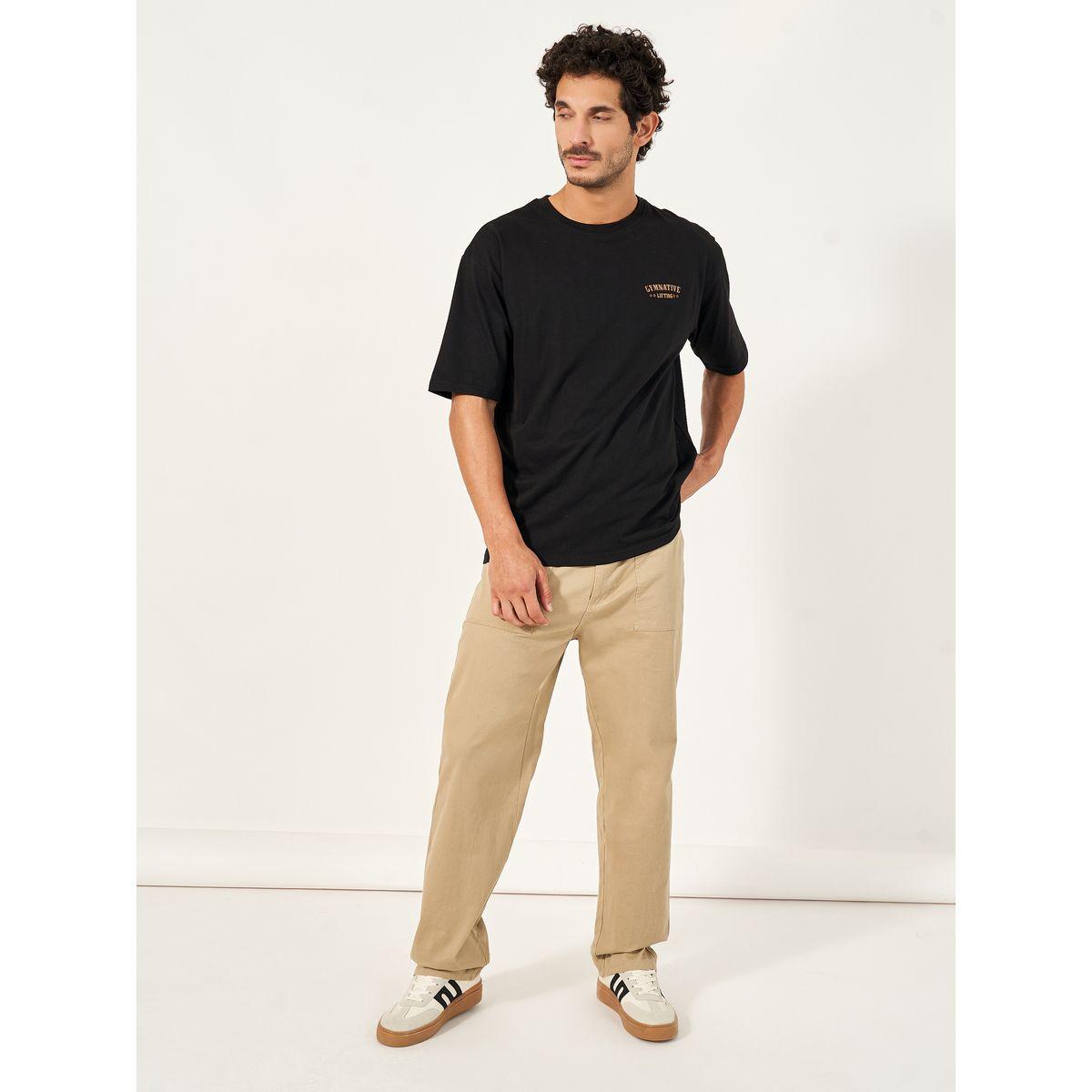 تيشيرت فضفاض بياقة دائرية وطبعة كتابة-men-clothing-sportswearandactivewear-tshirtsandpolos-image-2