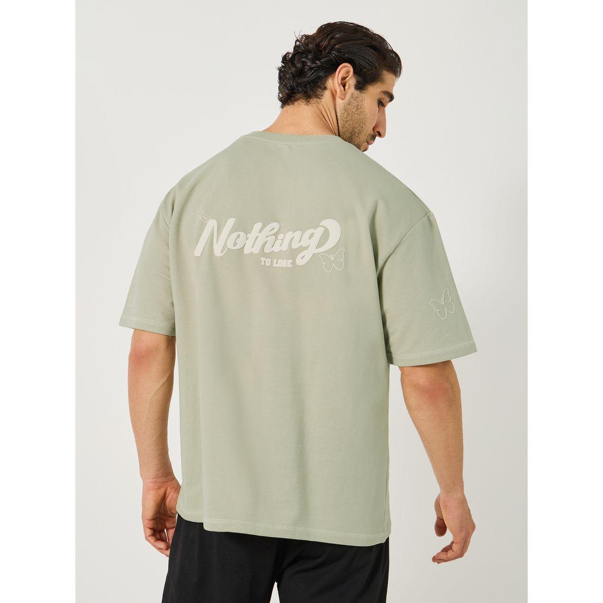 تيشيرت فضفاض بنسيج تيري وطبعة كتابة-men-clothing-tshirtsandpolos-tshirts-image-1