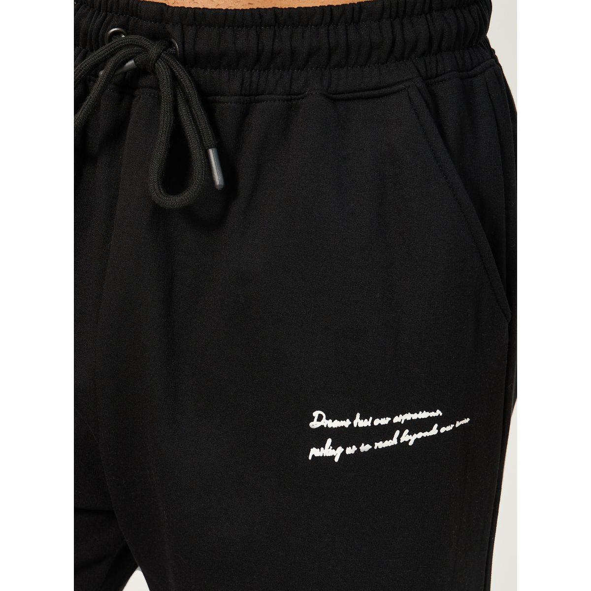 جوغر قطن بنسيج فليس فضفاض بطبعة كتابة-men-clothing-bottoms-joggers-image-3