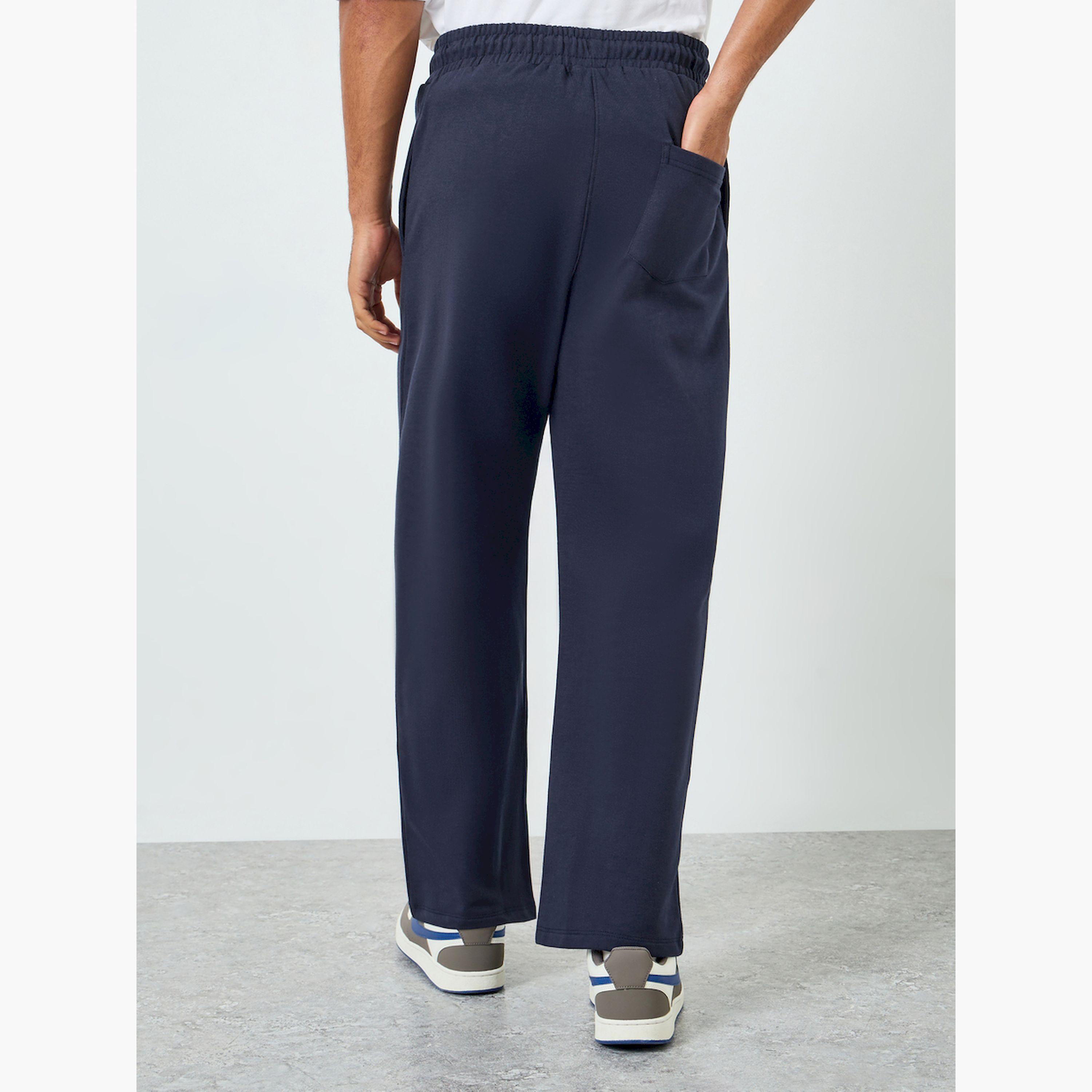 بنطال جوغر بقصة واسعة وشعار بسيط-men-clothing-bottoms-joggers-image-4