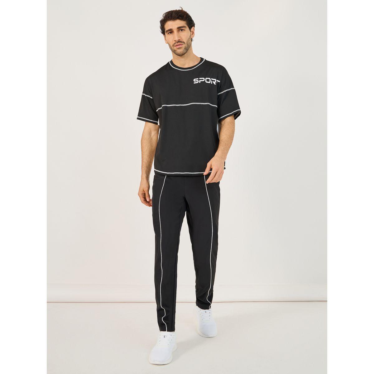 تيشيرت فضفاض بطبعة كتابة وتفاصيل مُتباينة-men-clothing-sportswearandactivewear-tshirtsandpolos-image-2