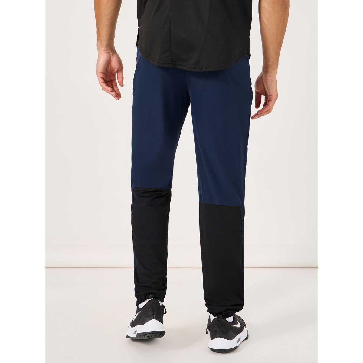 بنطال رياضي للتدريب بتفاصيل مُتباينة-men-clothing-sportswearandactivewear-bottoms-image-1