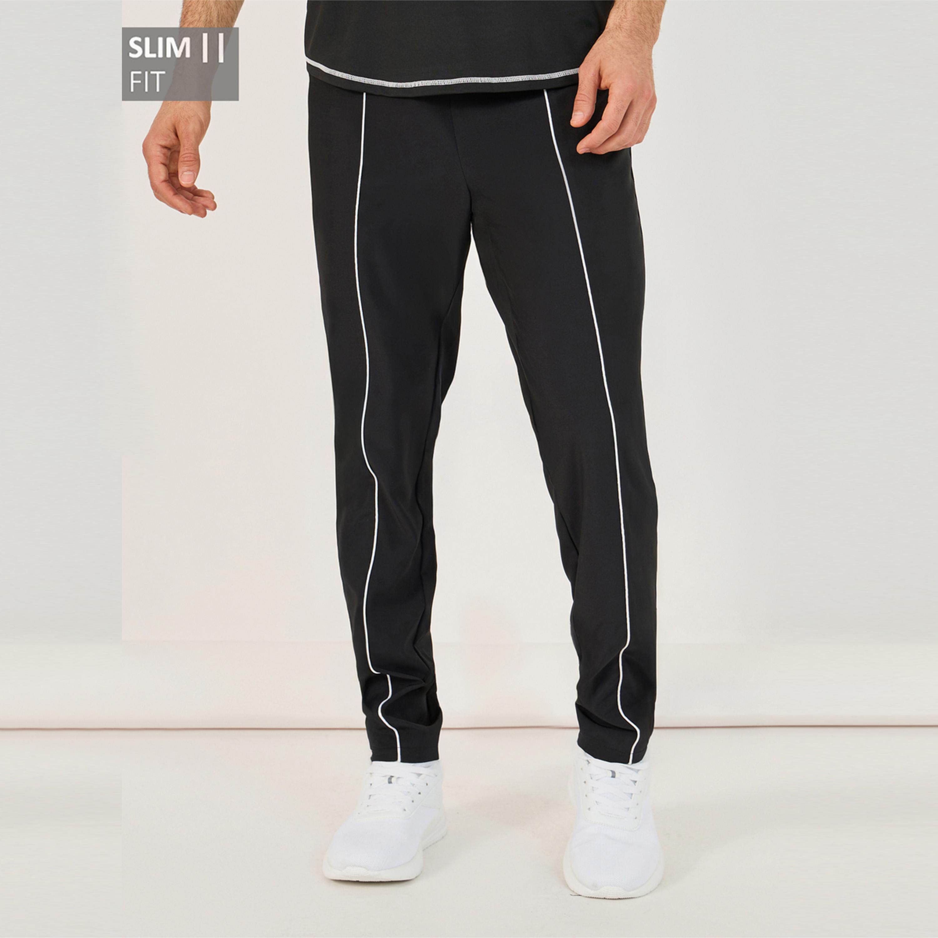ستايلي - بنطال رياضي ضيق من قماش مضغوط بأربعة اتجاهات مع حواف مزينة-men-clothing-sportswearandactivewear-bottoms-joggers-image-1