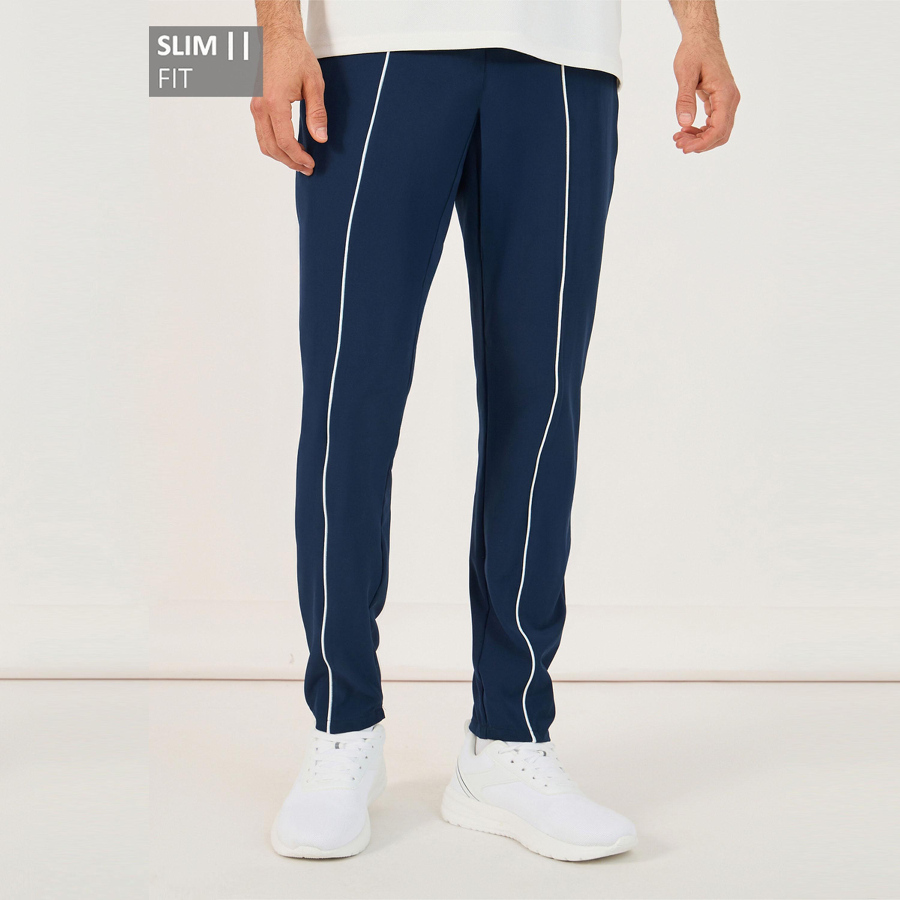 ستايلي - بنطال رياضي ضيق من قماش مضغوط بأربعة اتجاهات مع حواف مزينة-men-clothing-sportswearandactivewear-bottoms-image-1