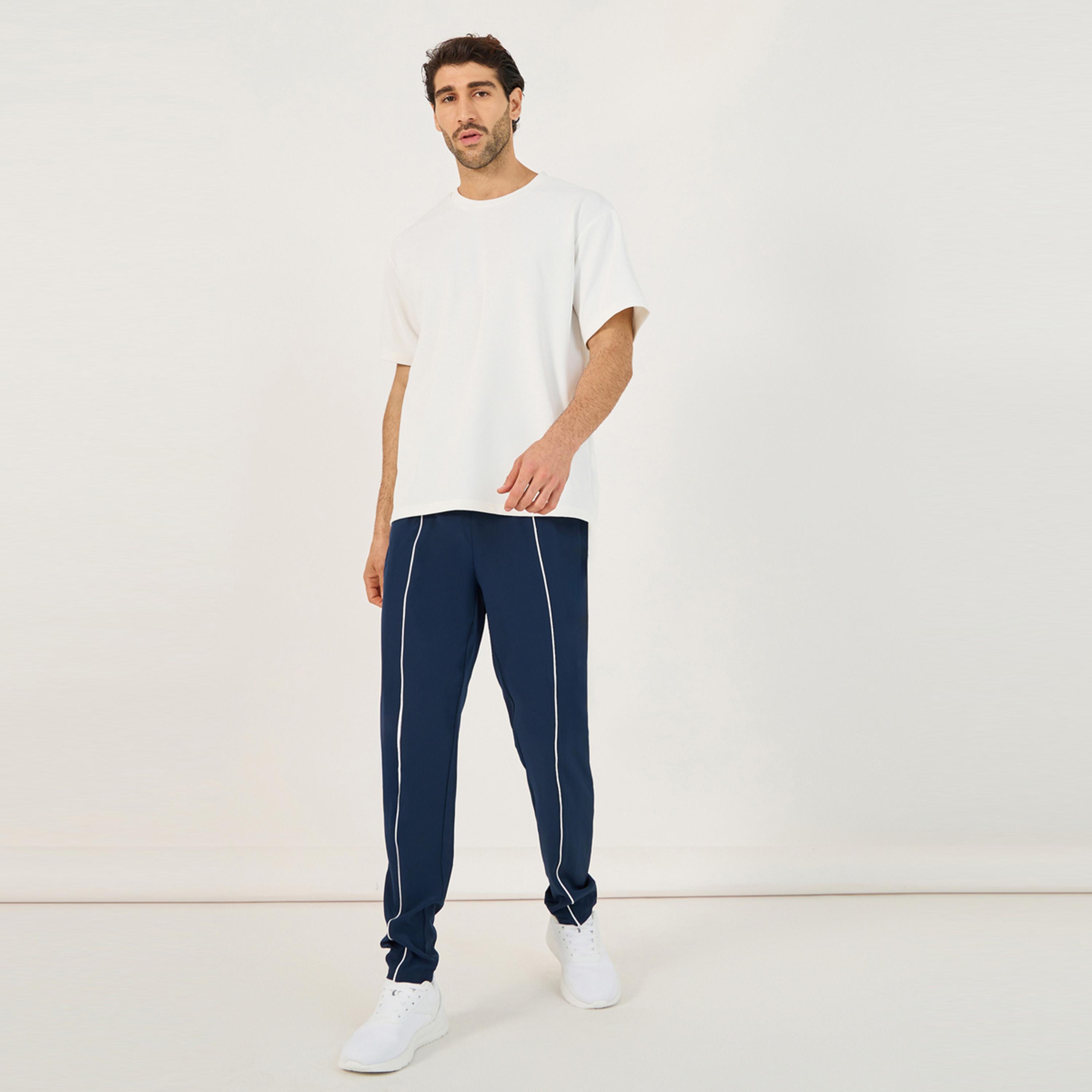 Styli Active 4-Way Stretch Compression Knit Slim Track Pants with Piping Detail-men-clothing-sportswearandactivewear-bottoms-image-2