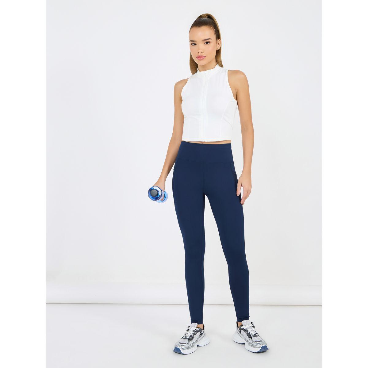 ليقنز سادة مزين بنقاط عاكسة للضوء مع جيب شبك-women-clothing-sportswearandactivewear-bottoms-joggersandtrackpants-image-1