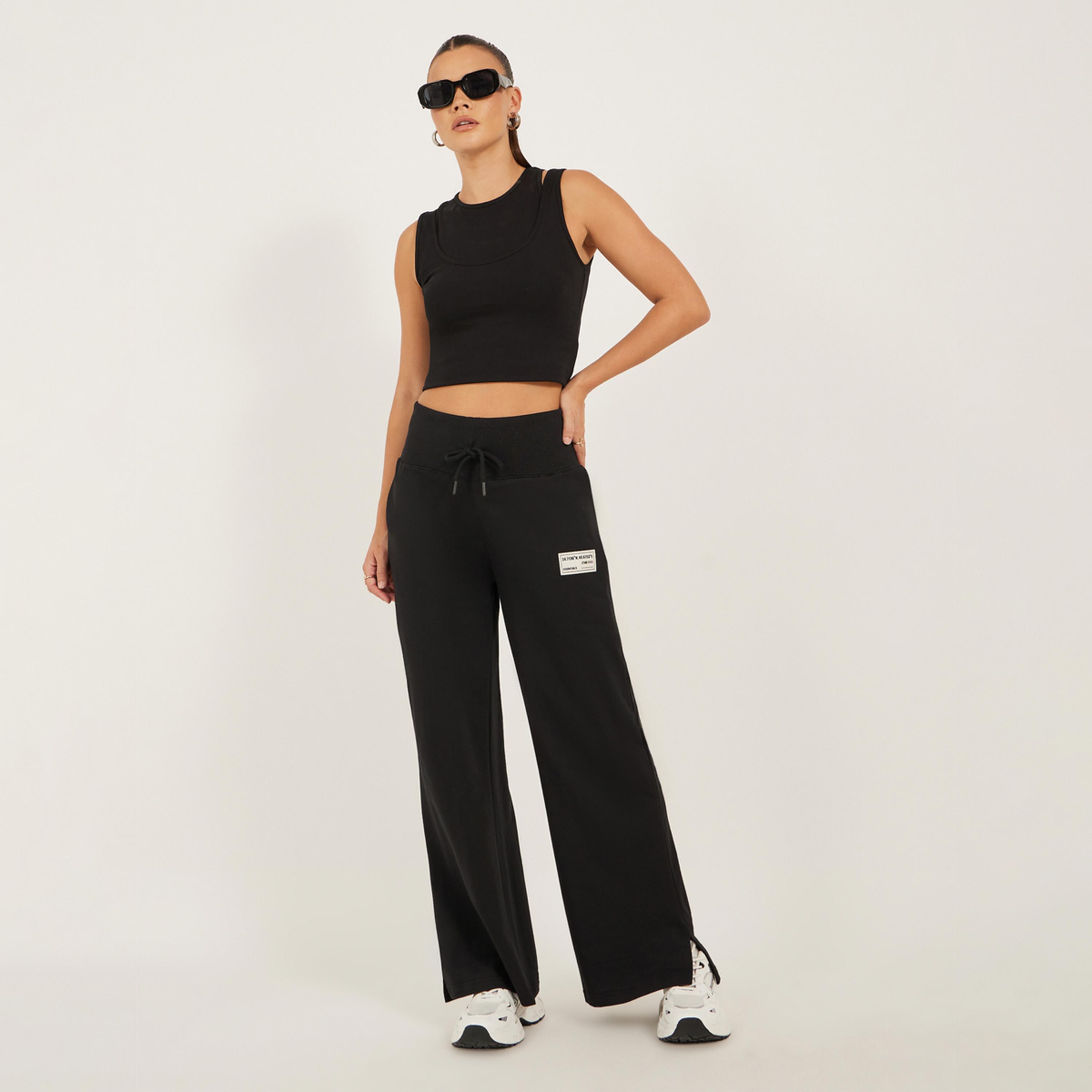 ستايلي - بنطال رياضي واسع الساق بتفاصيل شارة مع شق جانبي-women-clothing-bottoms-joggers-image-2