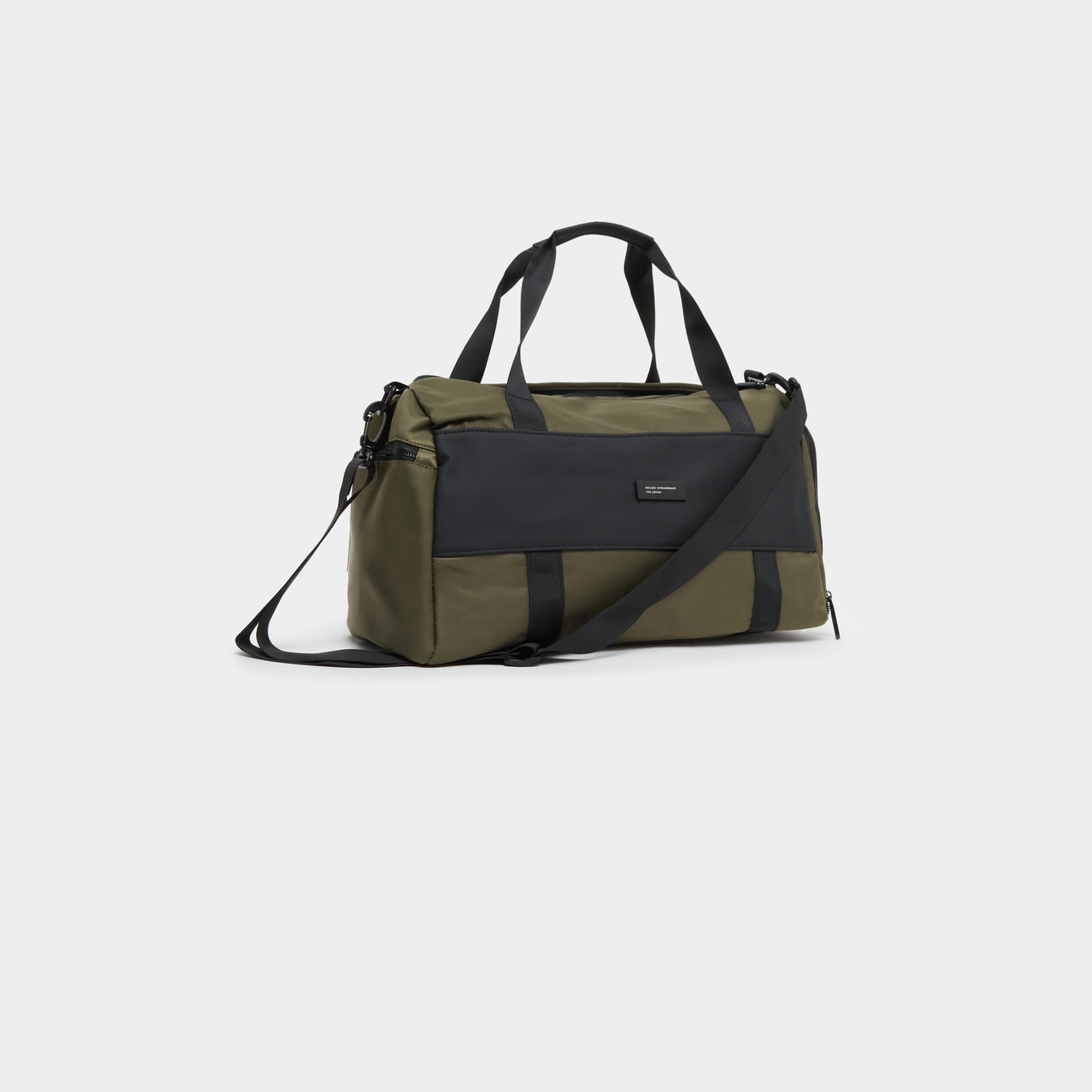 ستايلي - حقيبة رياضية بتفاصيل متباينة ومقابض مزدوجة-travel-luggagesandbags-dufflebags-image-1