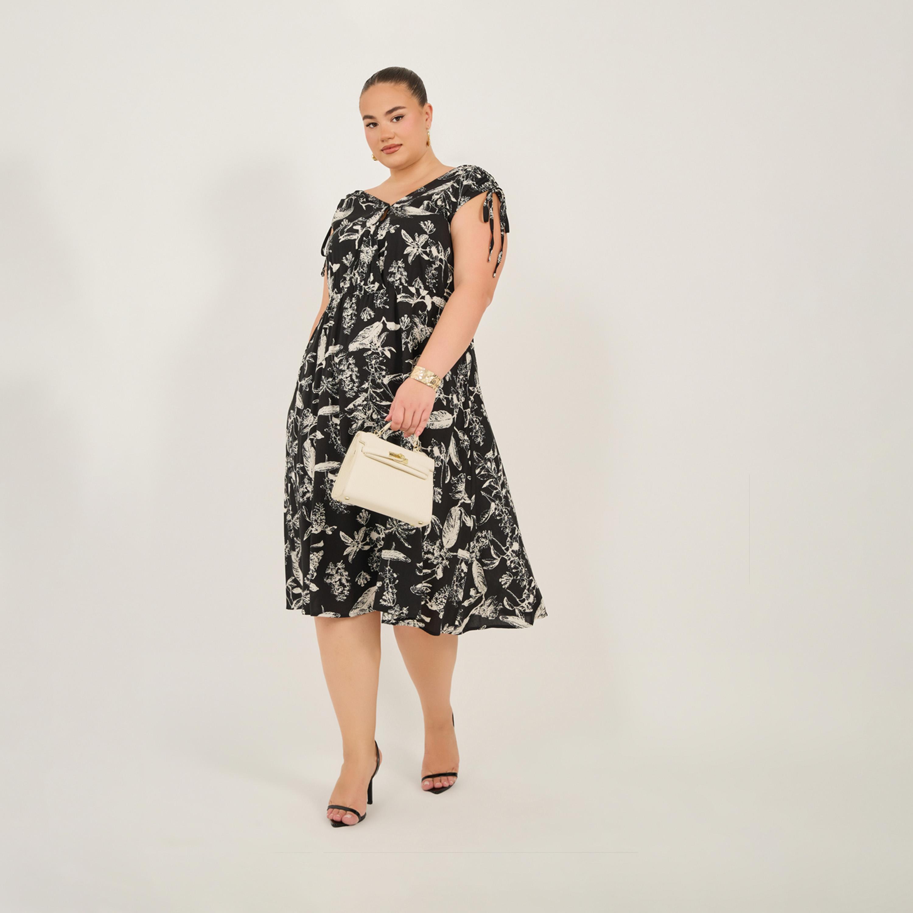Styli Plus Size All-Over Floral Print Sleeveless Knee Length Dress-women-clothing-dresses-image-1