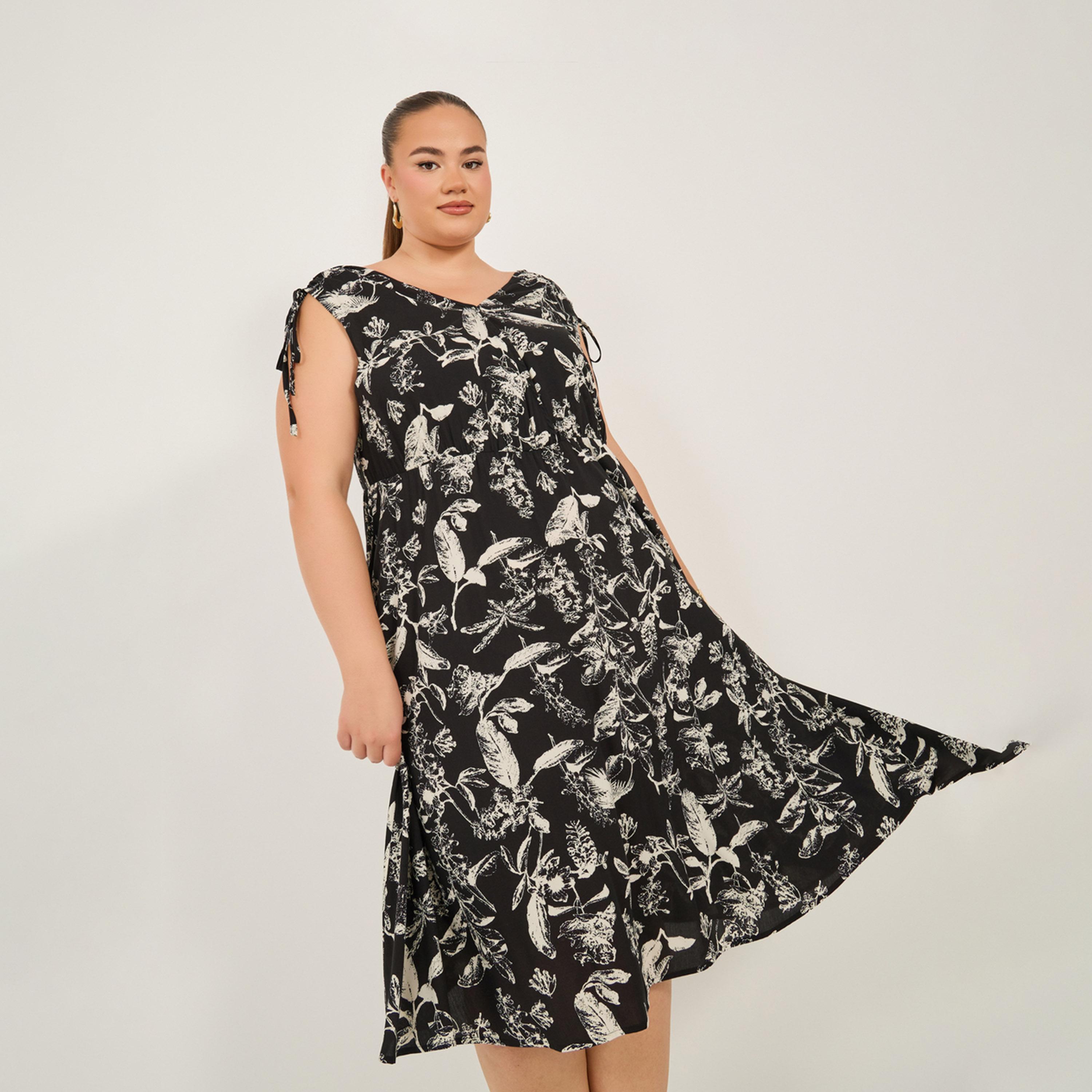 Styli Plus Size All-Over Floral Print Sleeveless Knee Length Dress-women-clothing-dresses-image-2