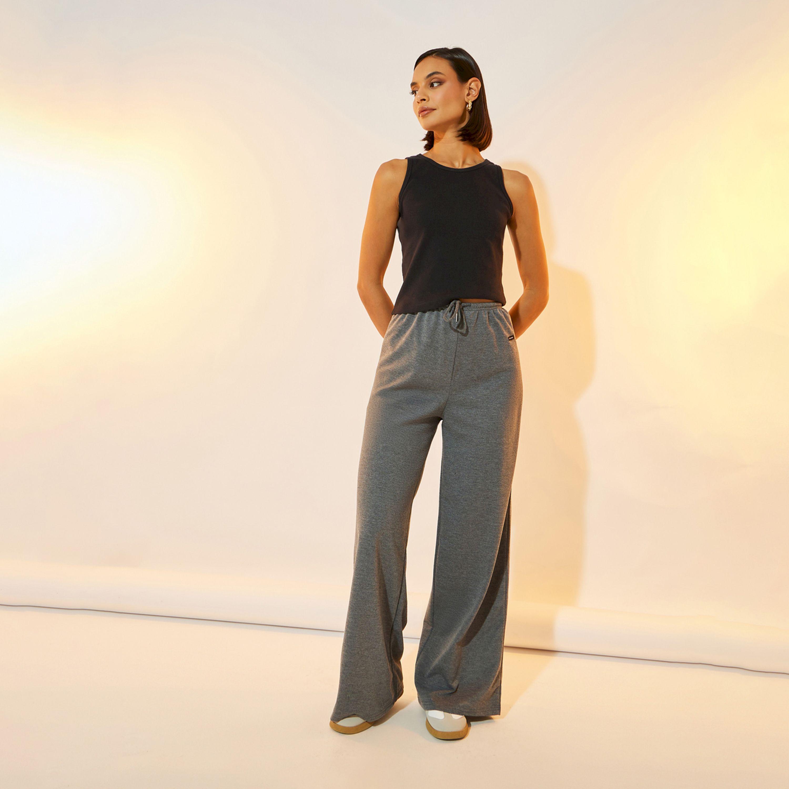 بنطال بأرجل واسعة وخصر متوسط مع شارة-women-clothing-bottoms-trousers-image-1