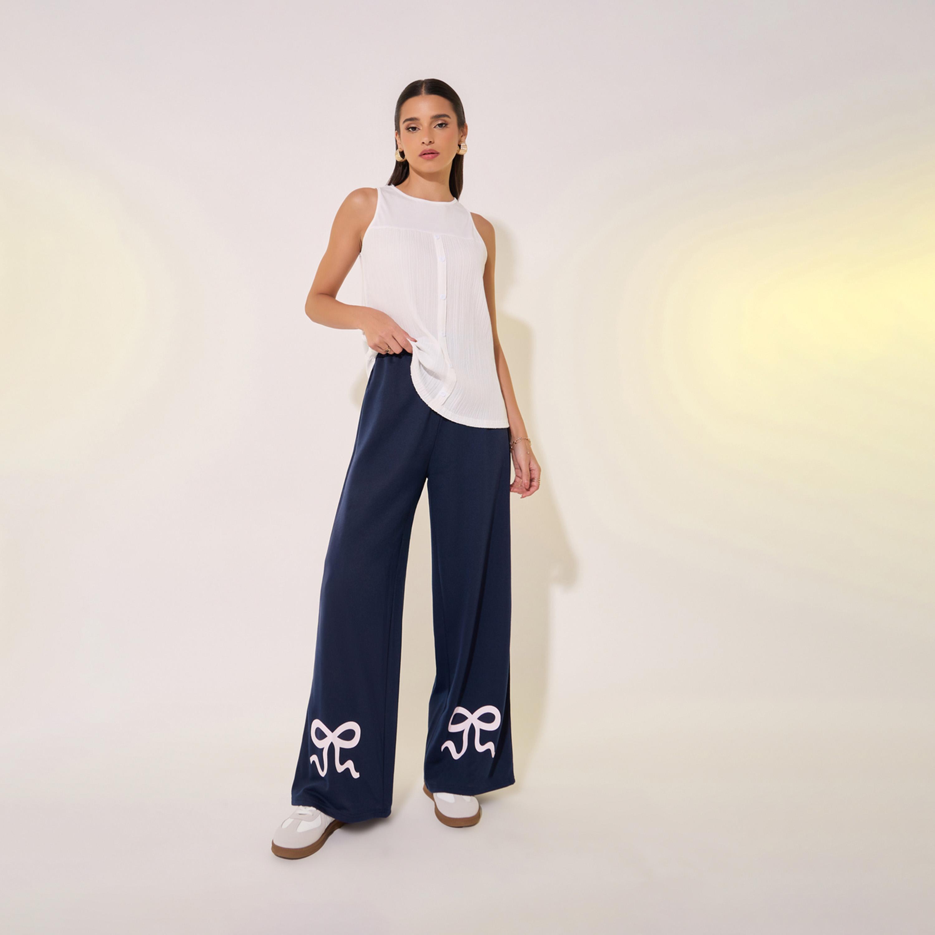 بنطال بأرجل واسعة وتفاصيل طبعة فيونكة-women-clothing-bottoms-trousers-image-1