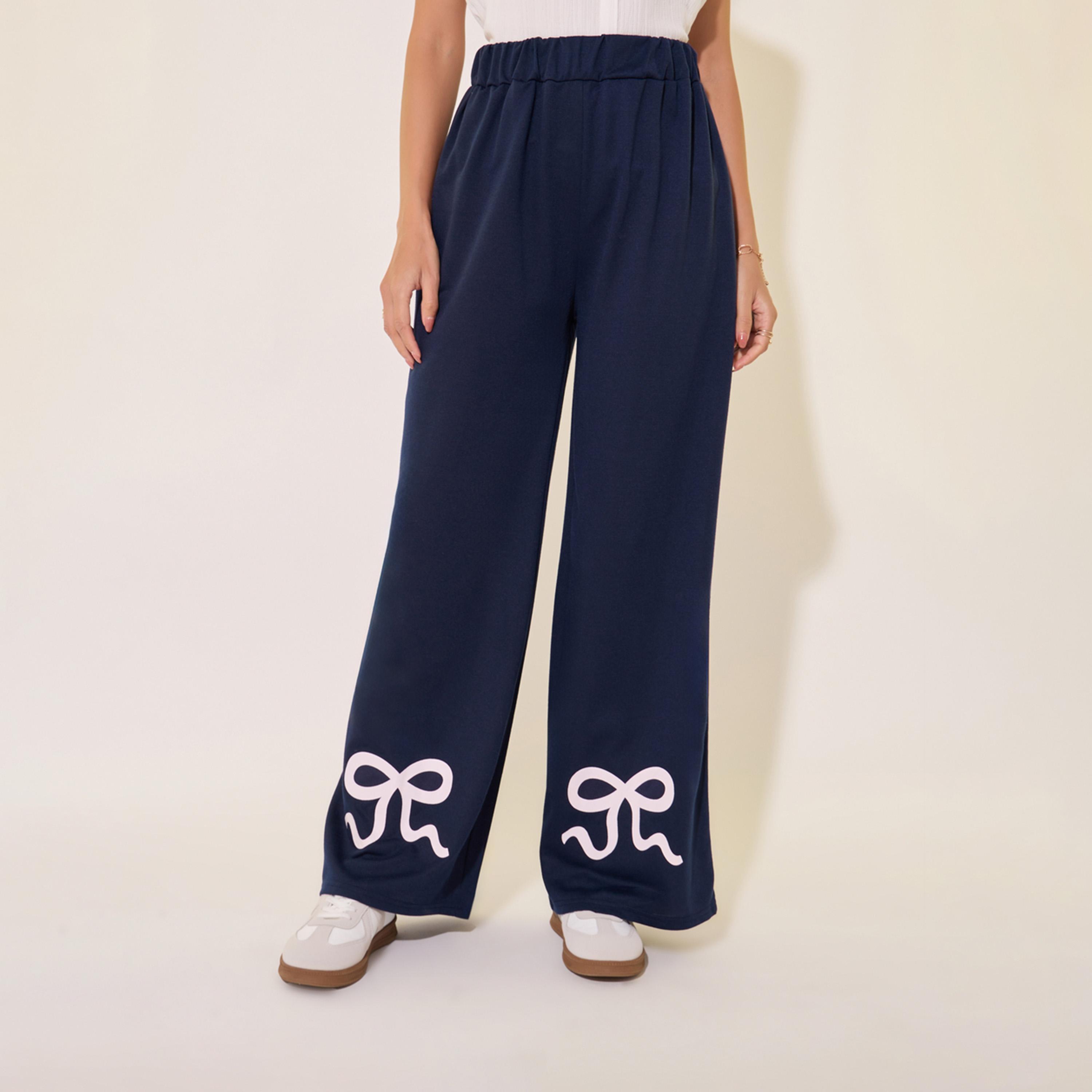 بنطال بأرجل واسعة وتفاصيل طبعة فيونكة-women-clothing-bottoms-trousers-image-2