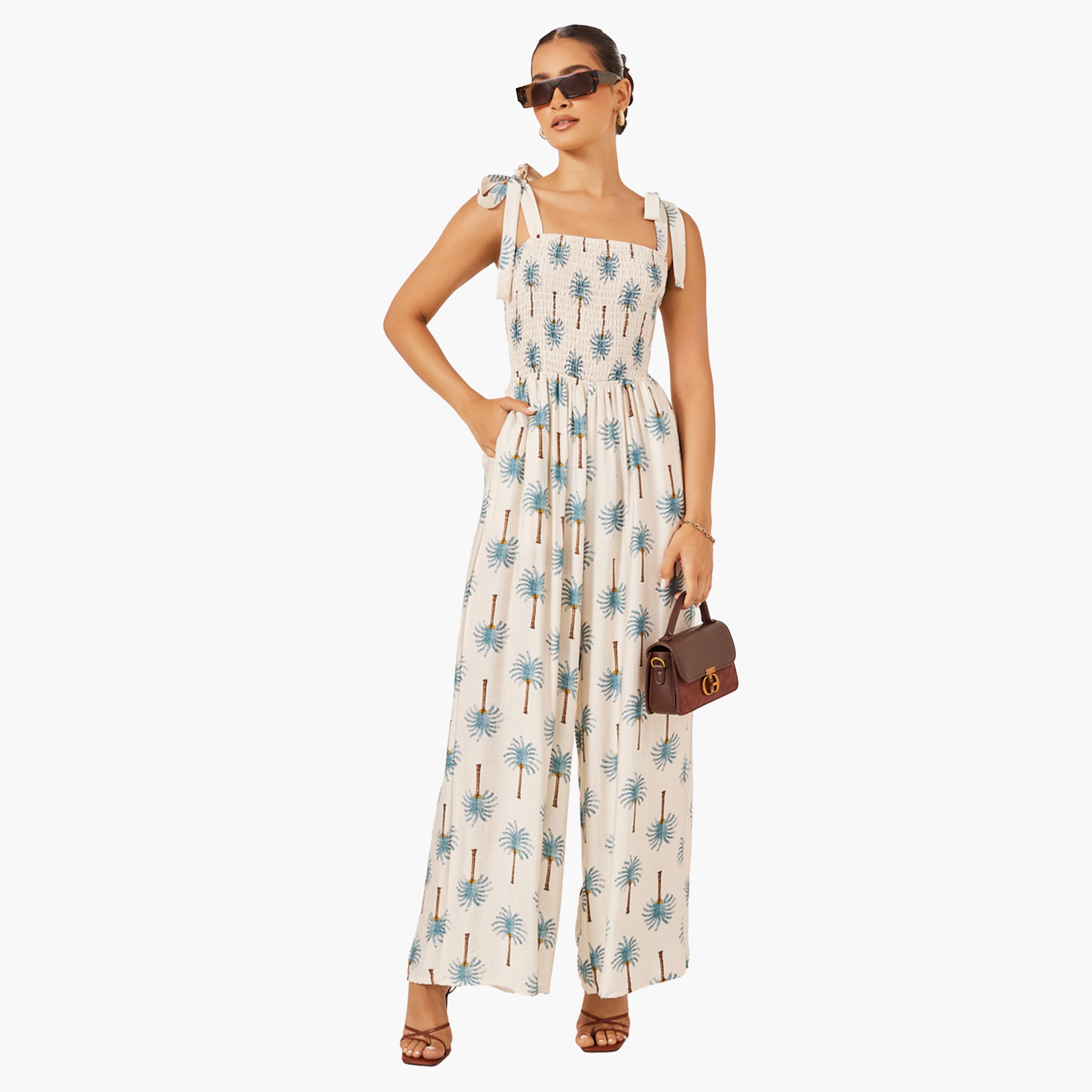 ستايلي-  جمبسوت واسع الساق بطبعة نخيل زرقاء-women-clothing-jumpsuits-image-1