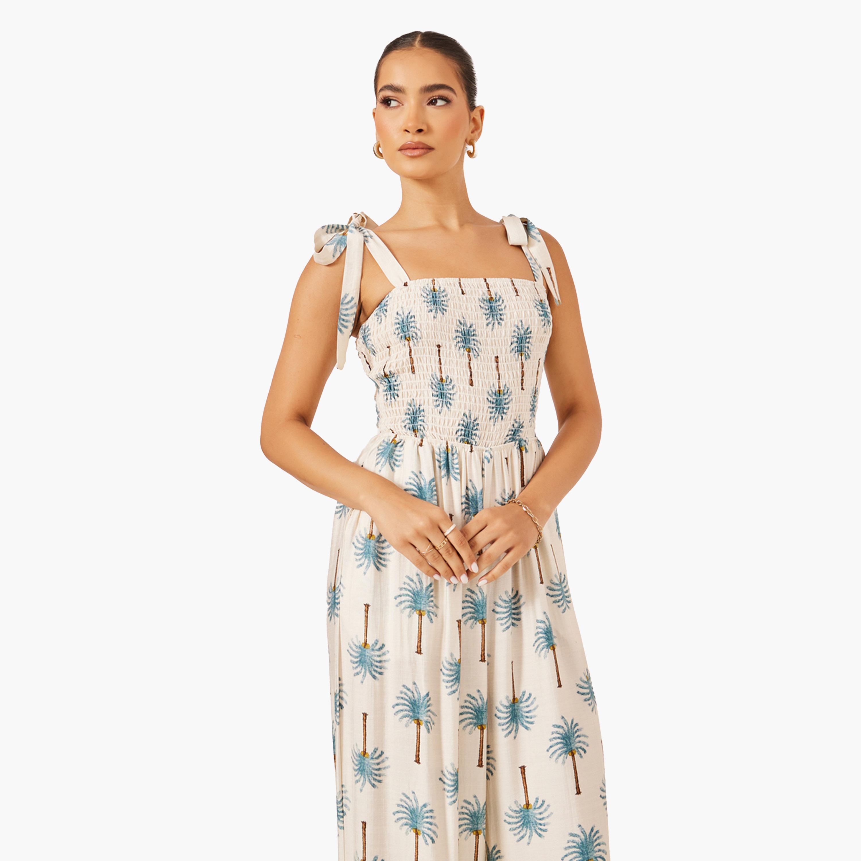ستايلي-  جمبسوت واسع الساق بطبعة نخيل زرقاء-women-clothing-jumpsuits-image-3