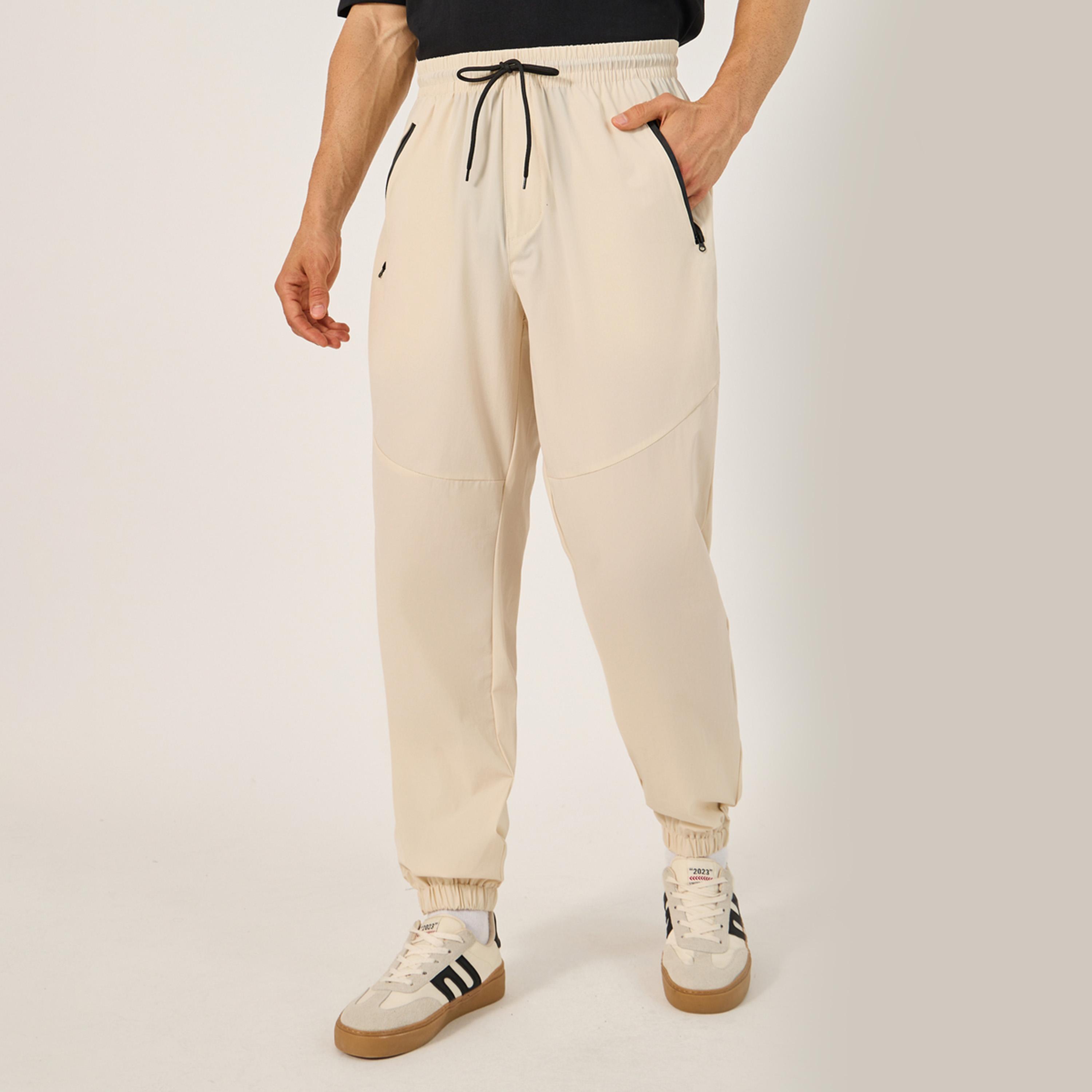 Styli Solid Relaxed Fit Elasticated Cuff Joggers with Contrast Zip detail-men-clothing-bottoms-joggers-image-1