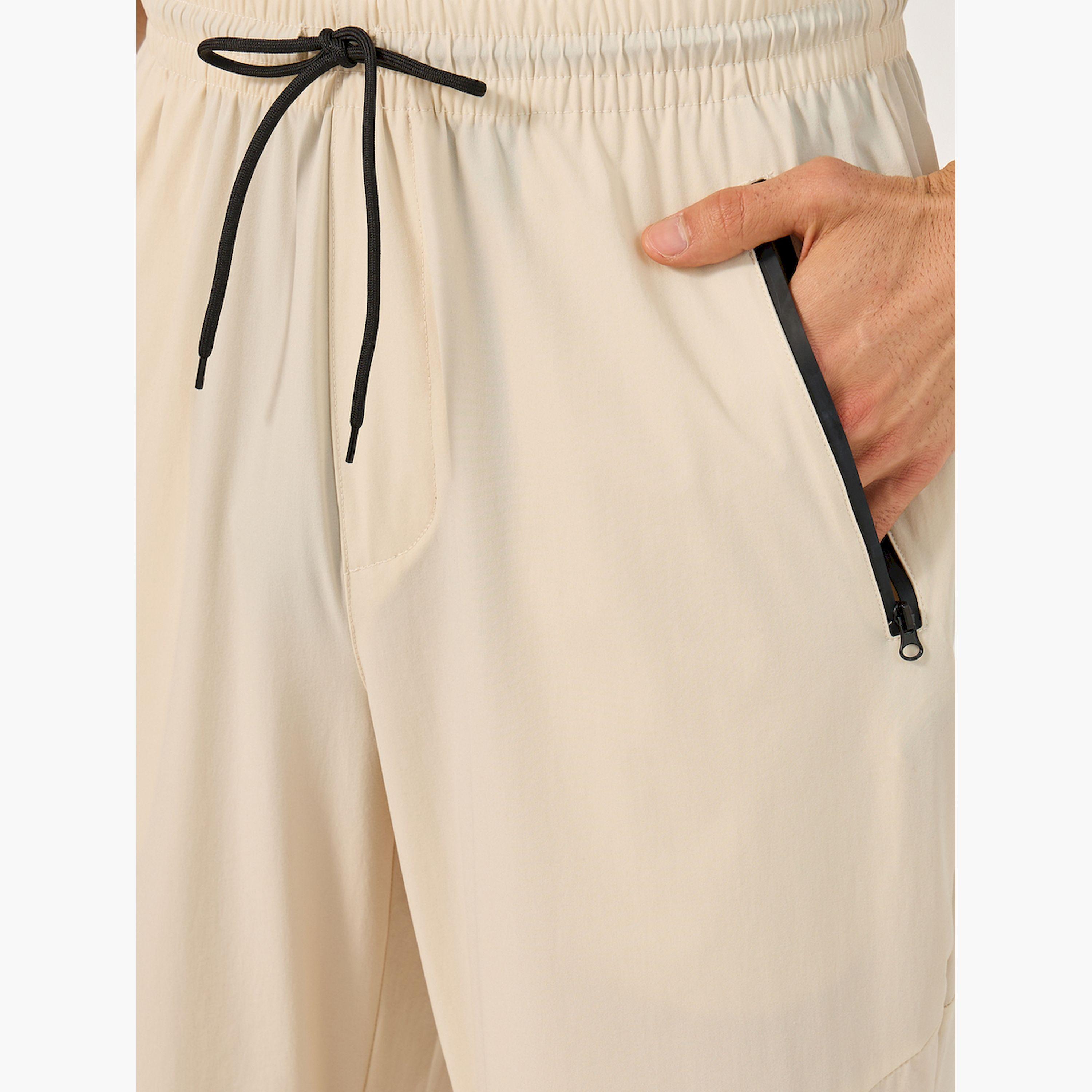 Styli Solid Relaxed Fit Elasticated Cuff Joggers with Contrast Zip detail-men-clothing-bottoms-joggers-image-3