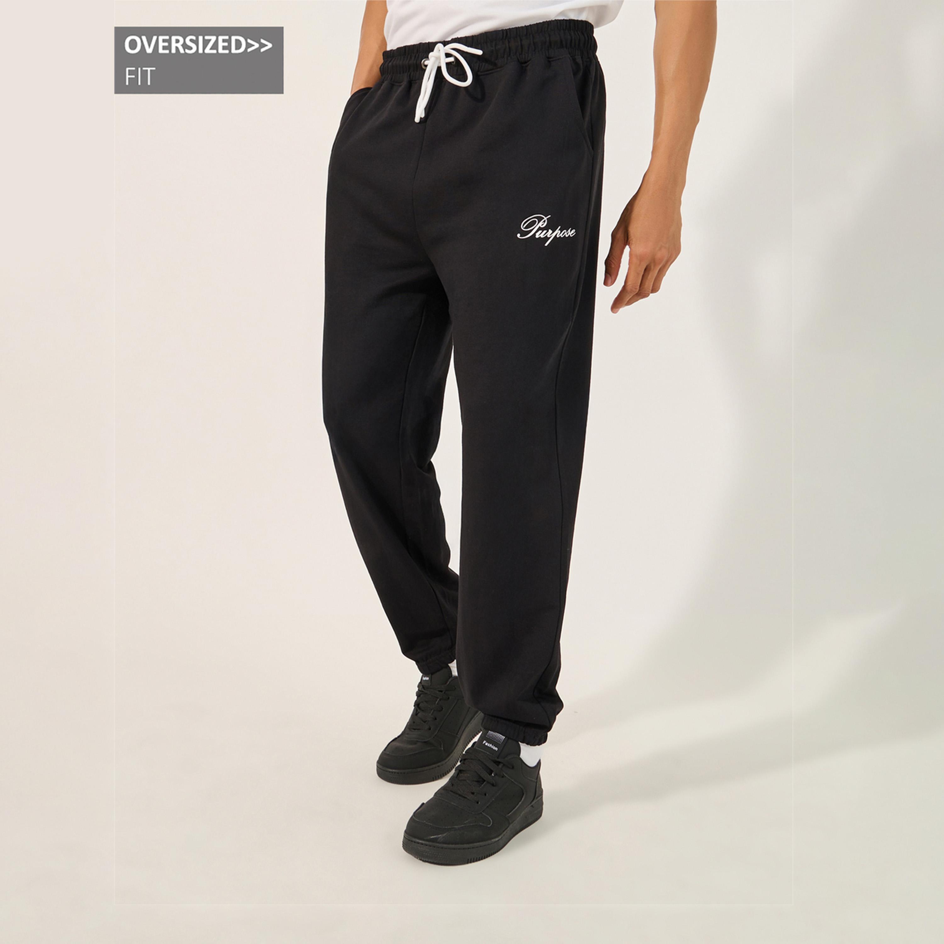 ستايلي - بنطال رياضي كبير الحجم بطبعة شعار بسيط مع رباط-men-clothing-bottoms-joggers-image-1