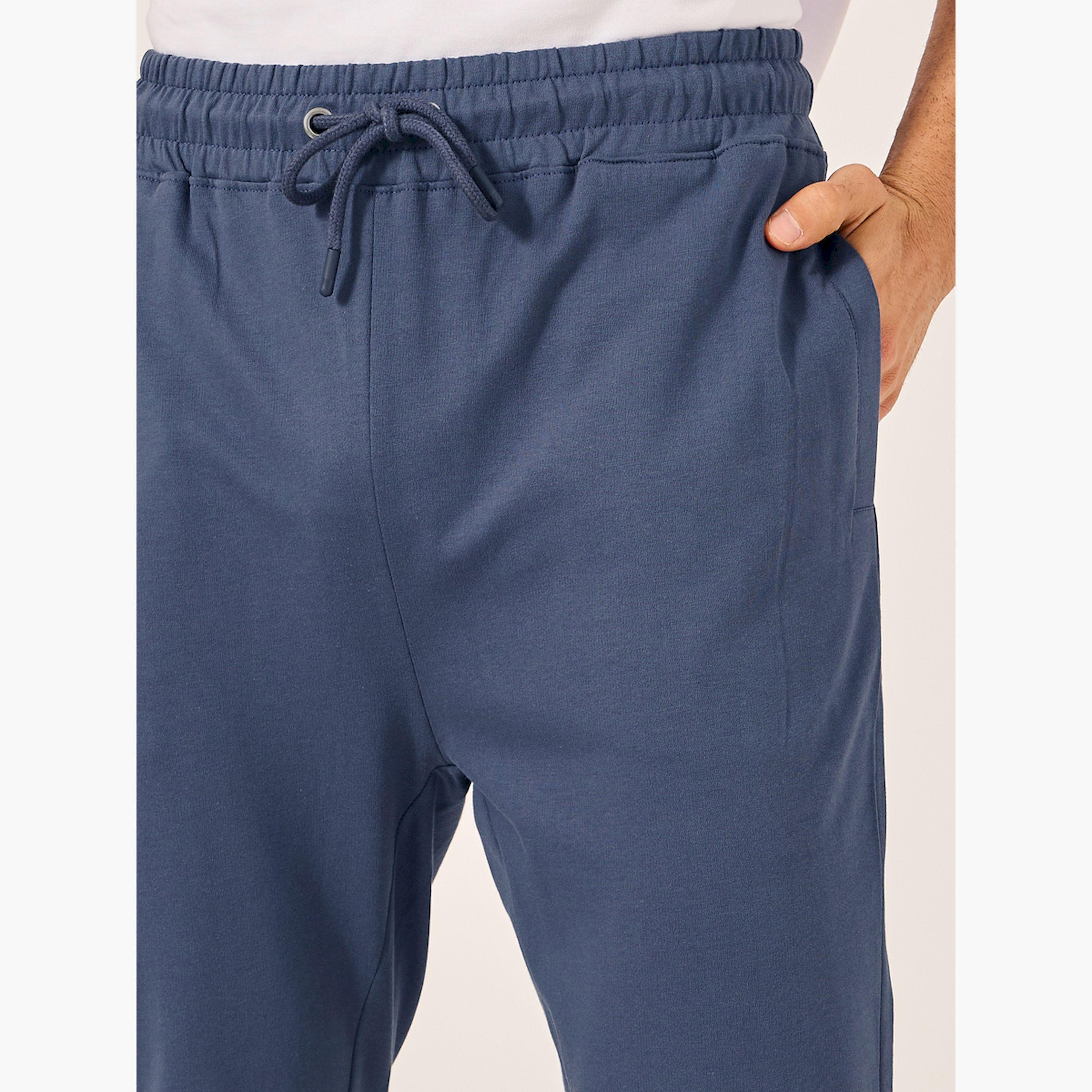 ستايلي - بنطال رياضي بخصر متوسط الارتفاع وقصة ضيقة وأساور مضلعة-men-clothing-bottoms-joggers-image-3
