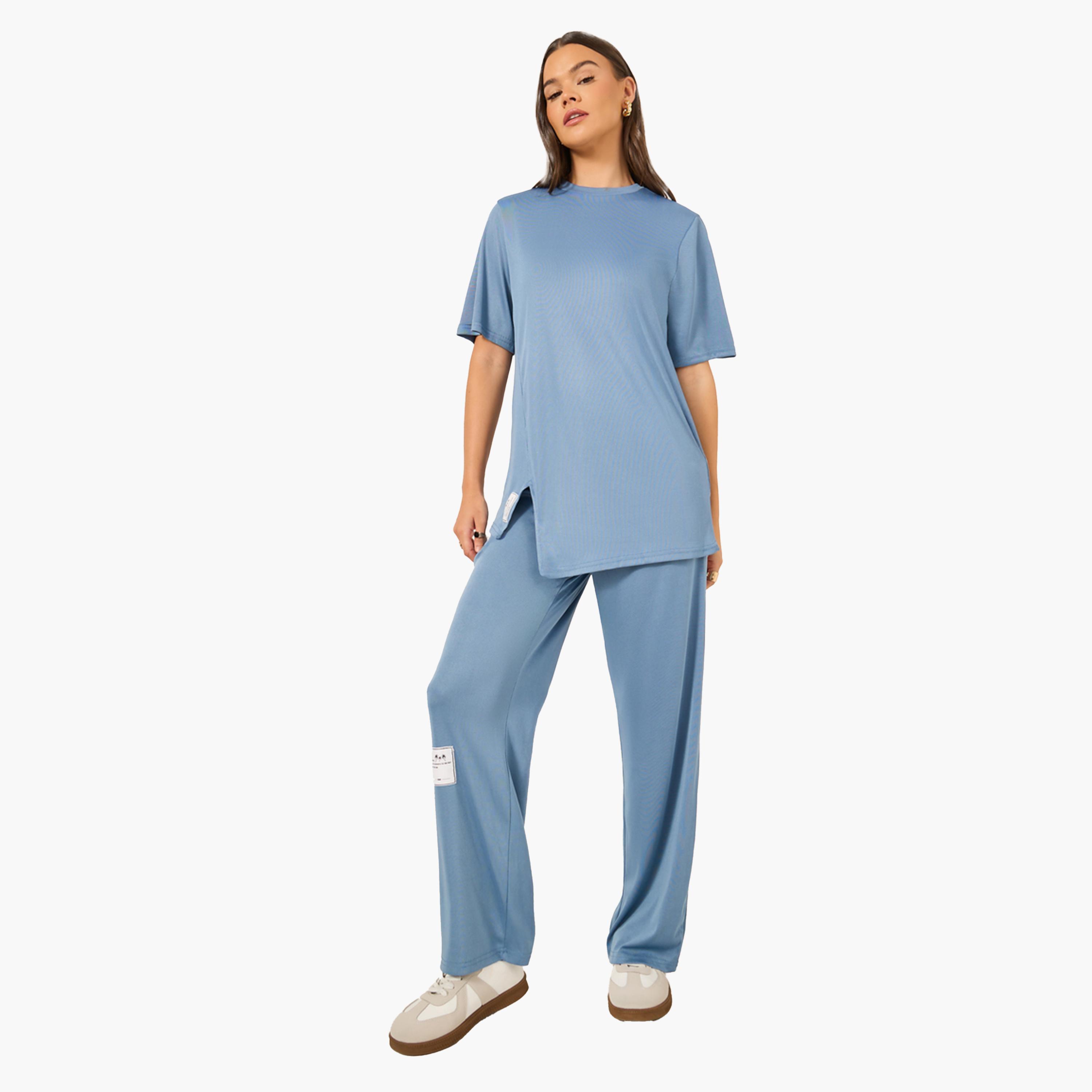 ستايلي - طقم قميص سادة كبير الحجم مع بنطال رياضي واسع الساق-women-clothing-coordsets-image-1